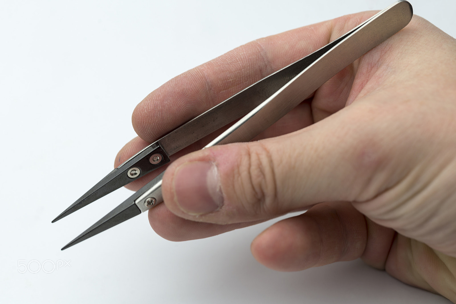 Nikon D600 + Nikon AF Micro-Nikkor 60mm F2.8D sample photo. Hand holding a pair of tweezers. photography