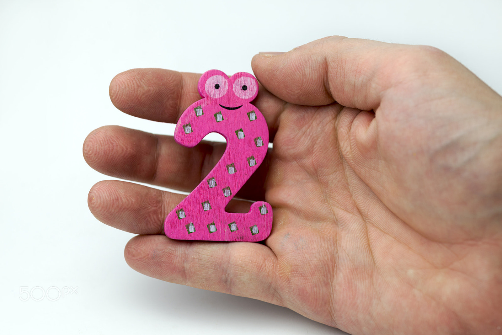 Nikon D600 + Nikon AF Micro-Nikkor 60mm F2.8D sample photo. Hand holds the number two. photography