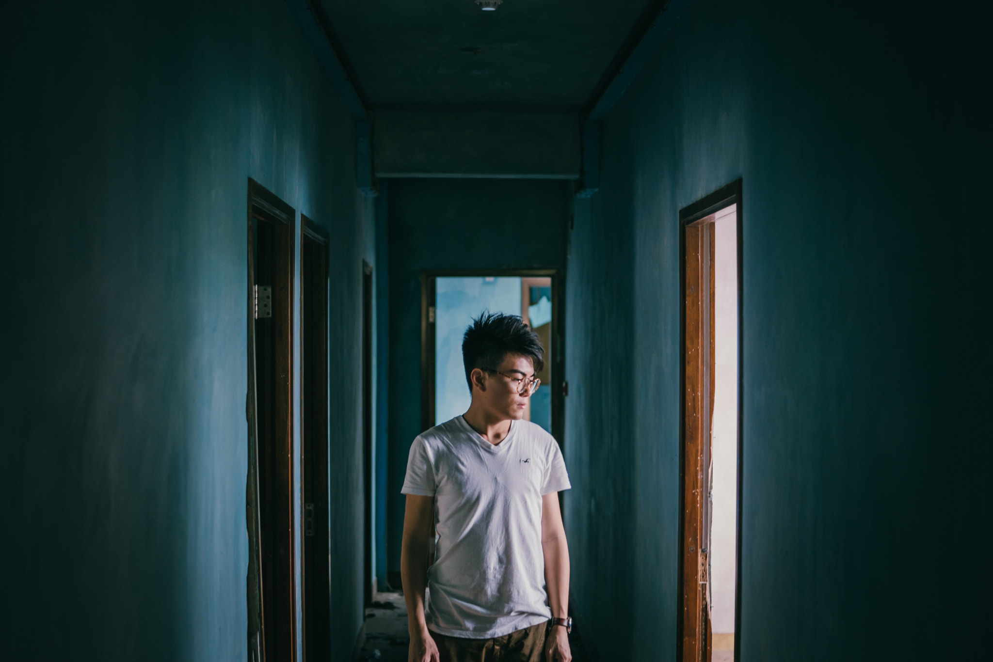 Sony a6300 + 30mm F1.4 DC DN | Contemporary 016 sample photo. Man in corridor photography
