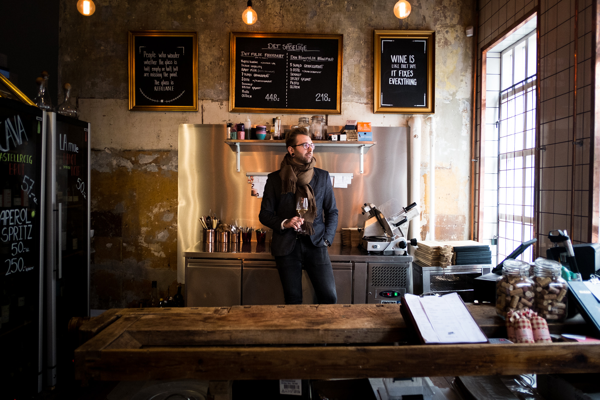 Fujifilm X-Pro1 + Fujifilm XF 18mm F2 R sample photo. The owner of a winebar in odense photography