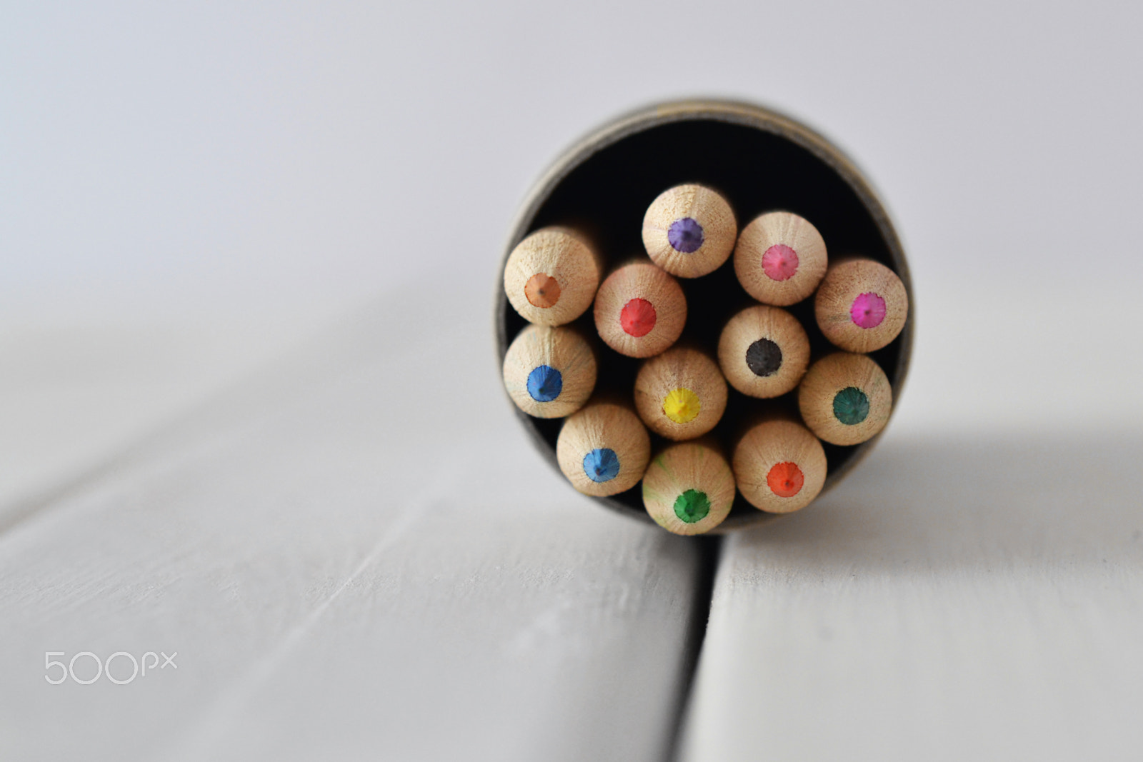 Nikon D3100 sample photo. Colored pencils in cylinder on white wood table photography