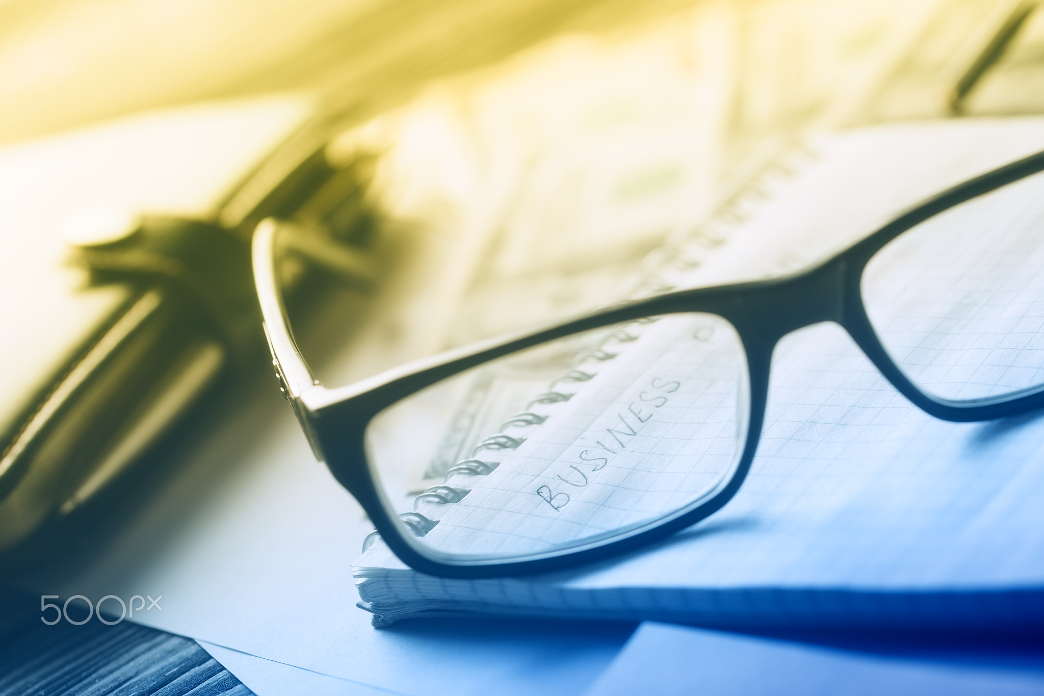 Business concept with diary and glasses