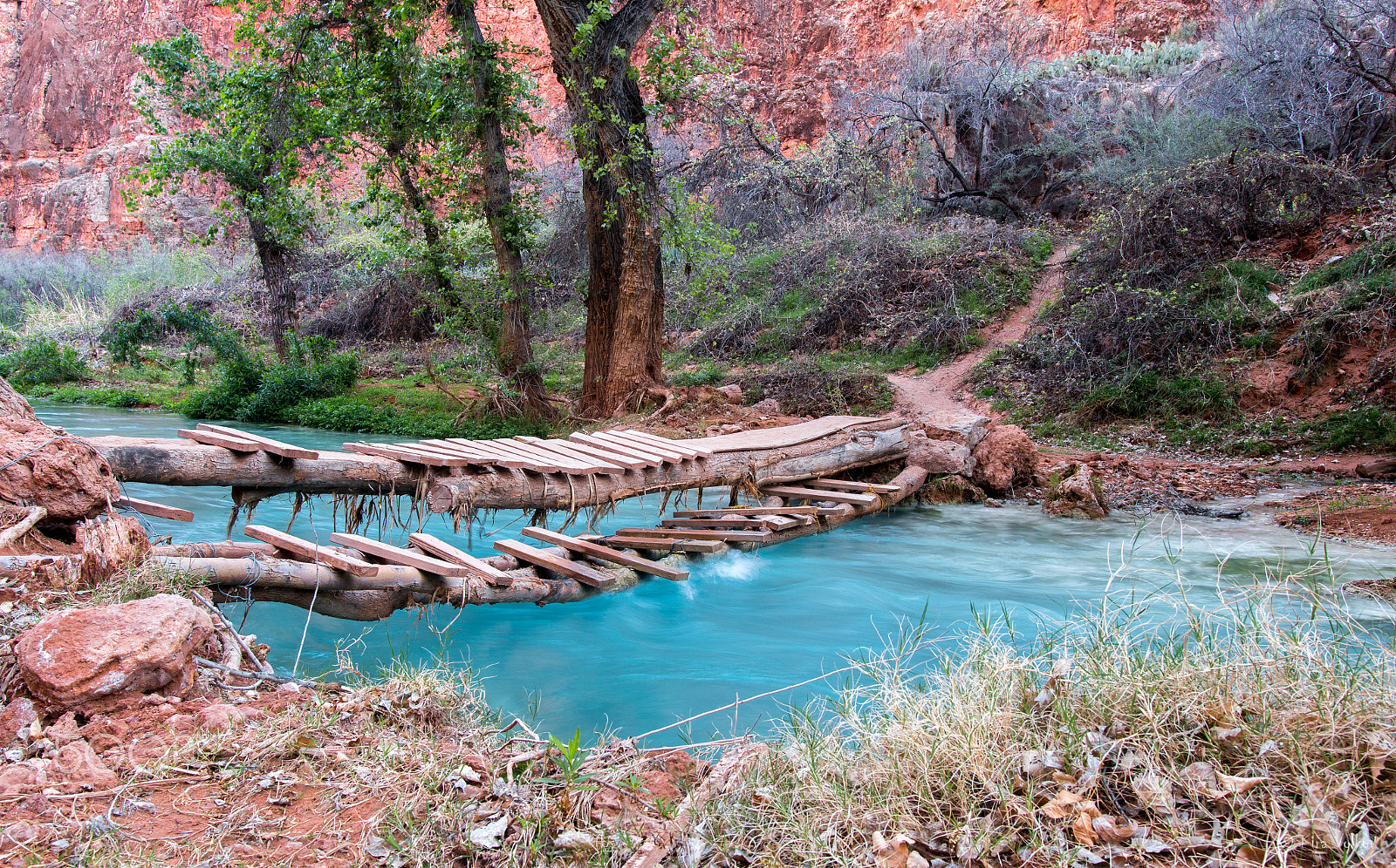 Canon EOS 70D + Sigma 18-35mm f/1.8 DC HSM sample photo. Hand-made bridge over small river in a canyon photography