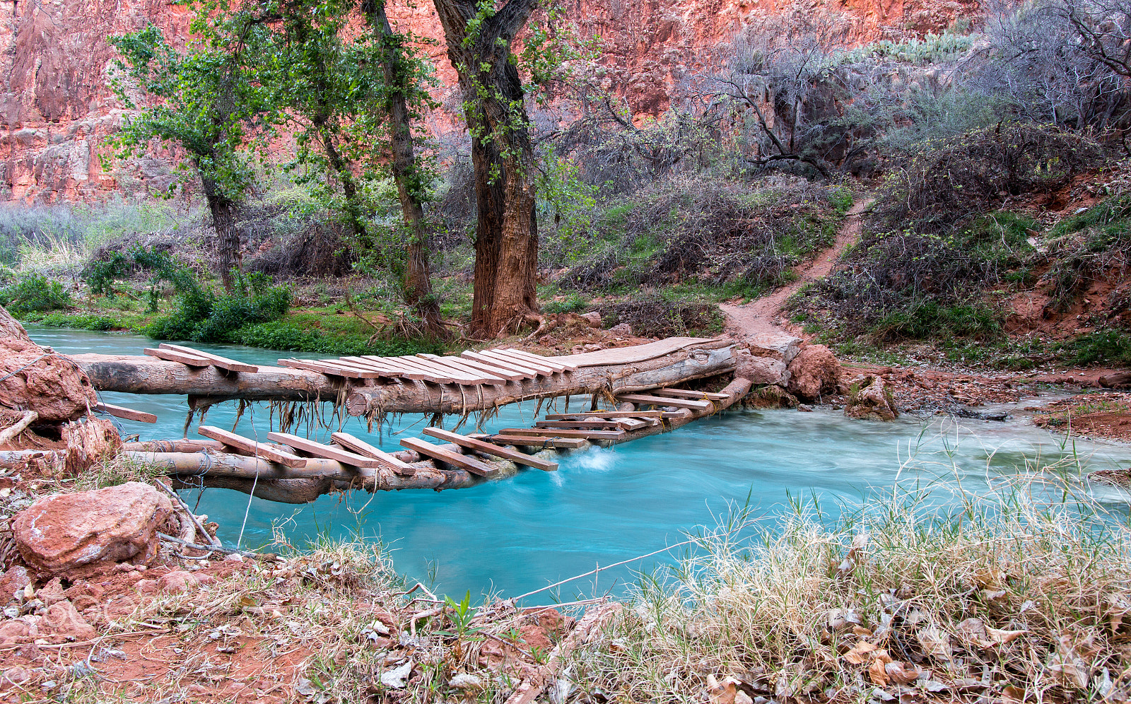 Sigma 18-35mm f/1.8 DC HSM sample photo. Hand-made bridge over small river in a canyon photography