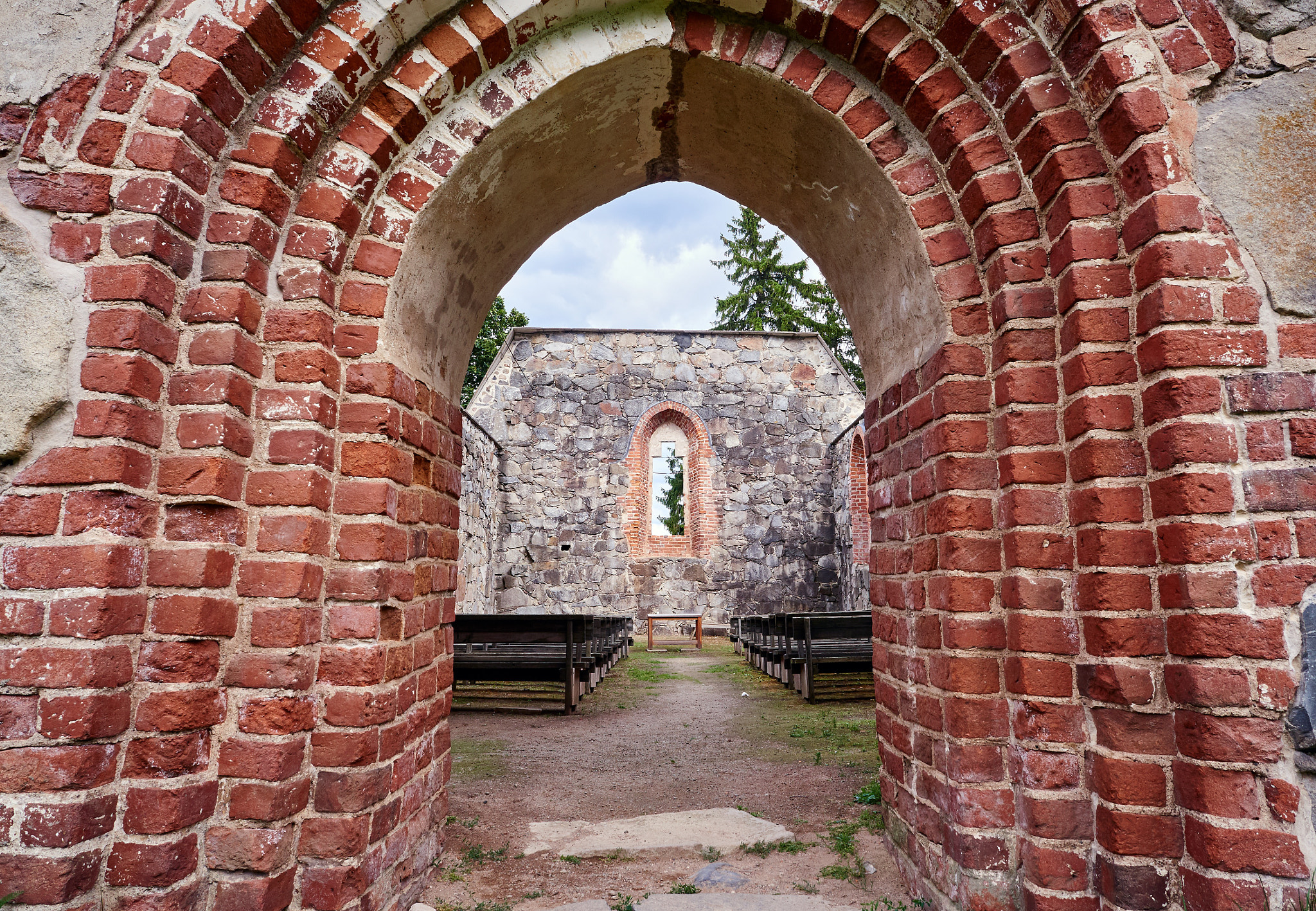Olympus M.ZUIKO DIGITAL ED 12-40mm 1:2.8 sample photo. Doorway of an old roofless church ruins on a beautiful sunny mid-summer day in finland photography