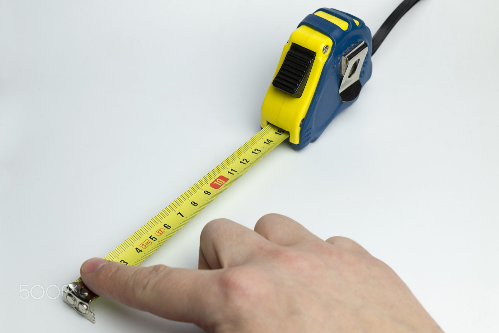 Nikon D600 + Nikon AF Micro-Nikkor 60mm F2.8D sample photo. Hand on a white background holding a tape measure. photography