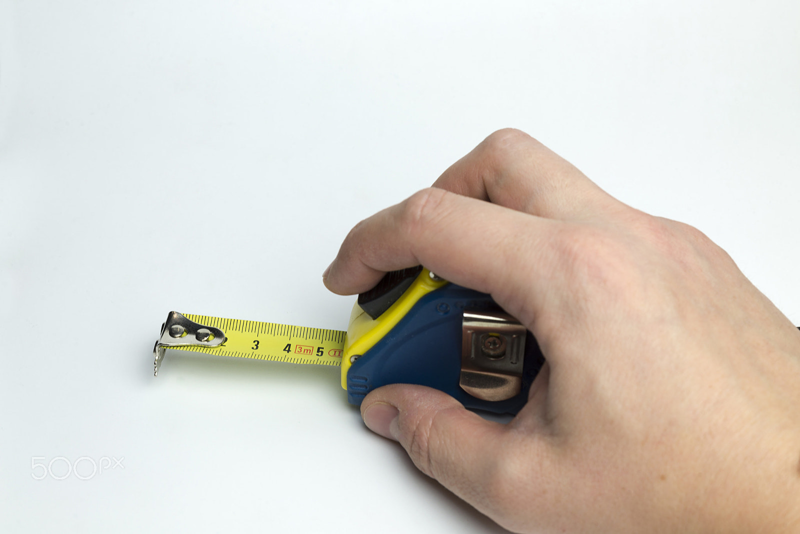 Nikon D600 + Nikon AF Micro-Nikkor 60mm F2.8D sample photo. Hand on a white background holding a tape measure. photography
