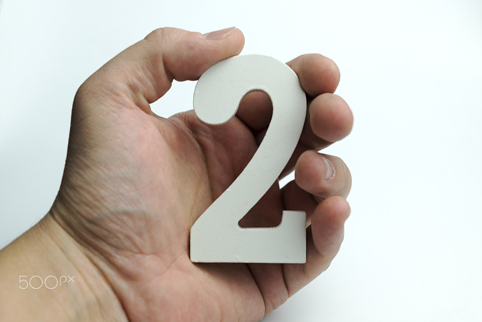 Nikon D600 + Nikon AF Micro-Nikkor 60mm F2.8D sample photo. Hand holds the number two. photography