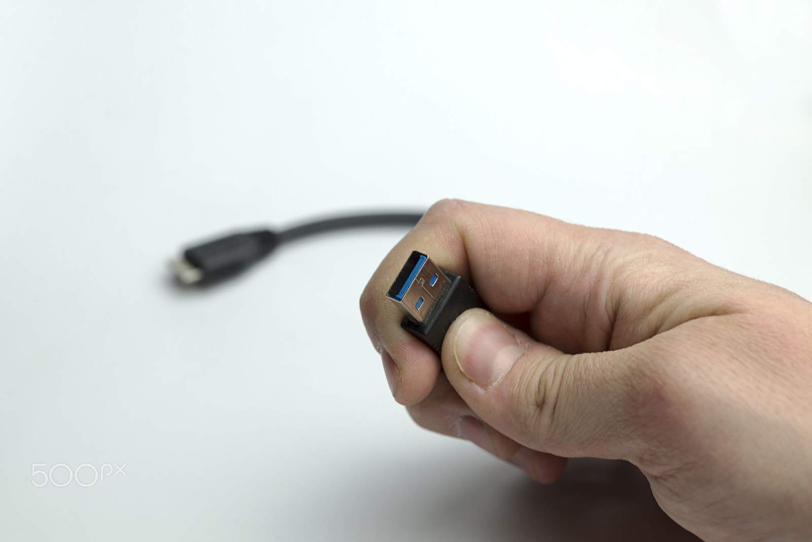 Nikon AF Micro-Nikkor 60mm F2.8D sample photo. Hand holds usb cable photography