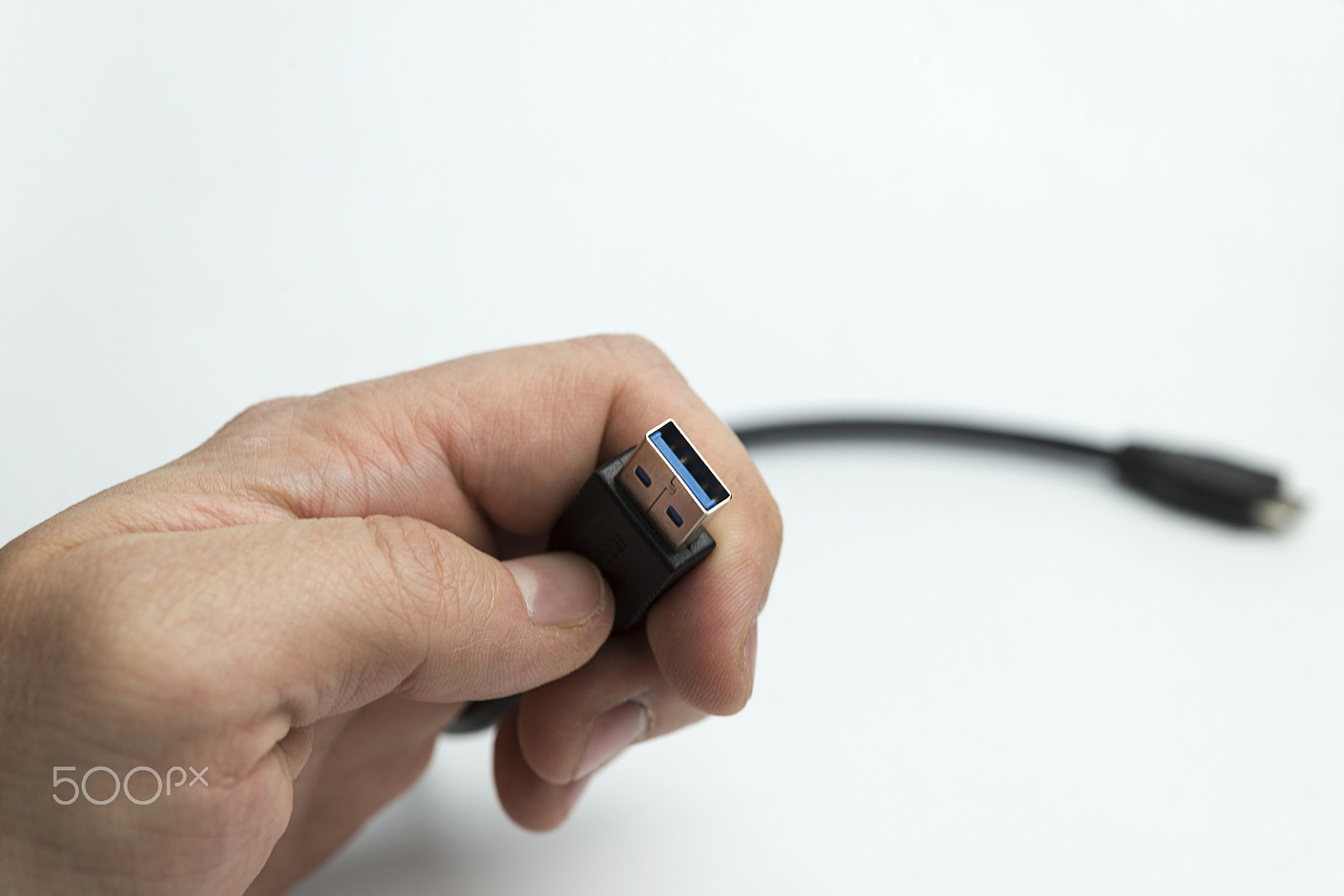 Nikon D600 + Nikon AF Micro-Nikkor 60mm F2.8D sample photo. Hand holds usb cable photography