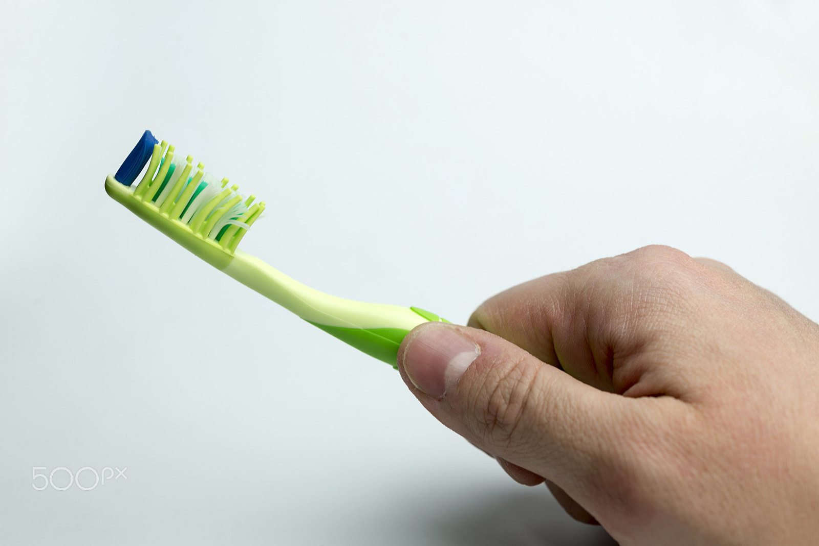 Nikon D600 + Nikon AF Micro-Nikkor 60mm F2.8D sample photo. Hand holding a toothbrush. photography