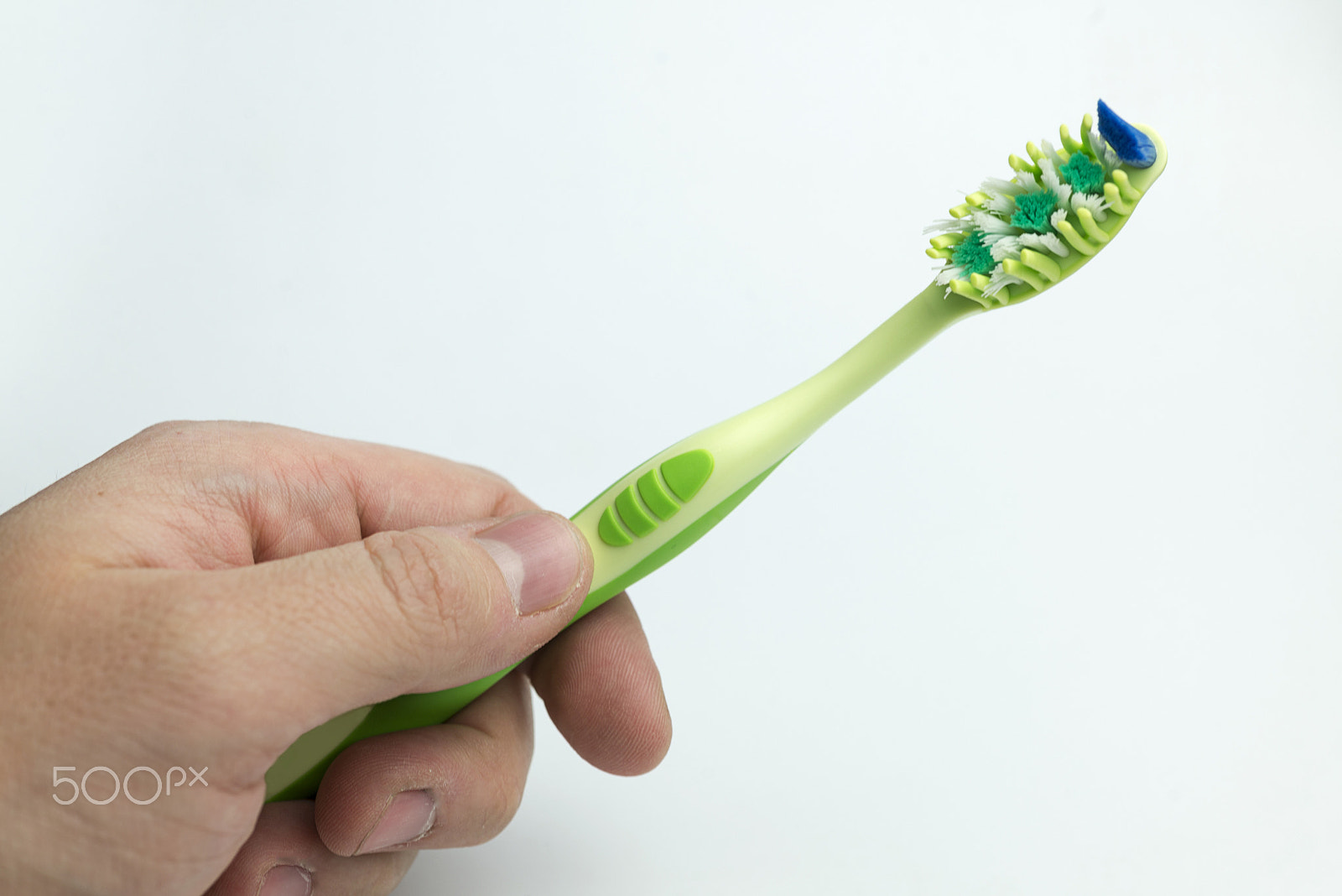 Nikon D600 + Nikon AF Micro-Nikkor 60mm F2.8D sample photo. Hand holding a toothbrush. photography