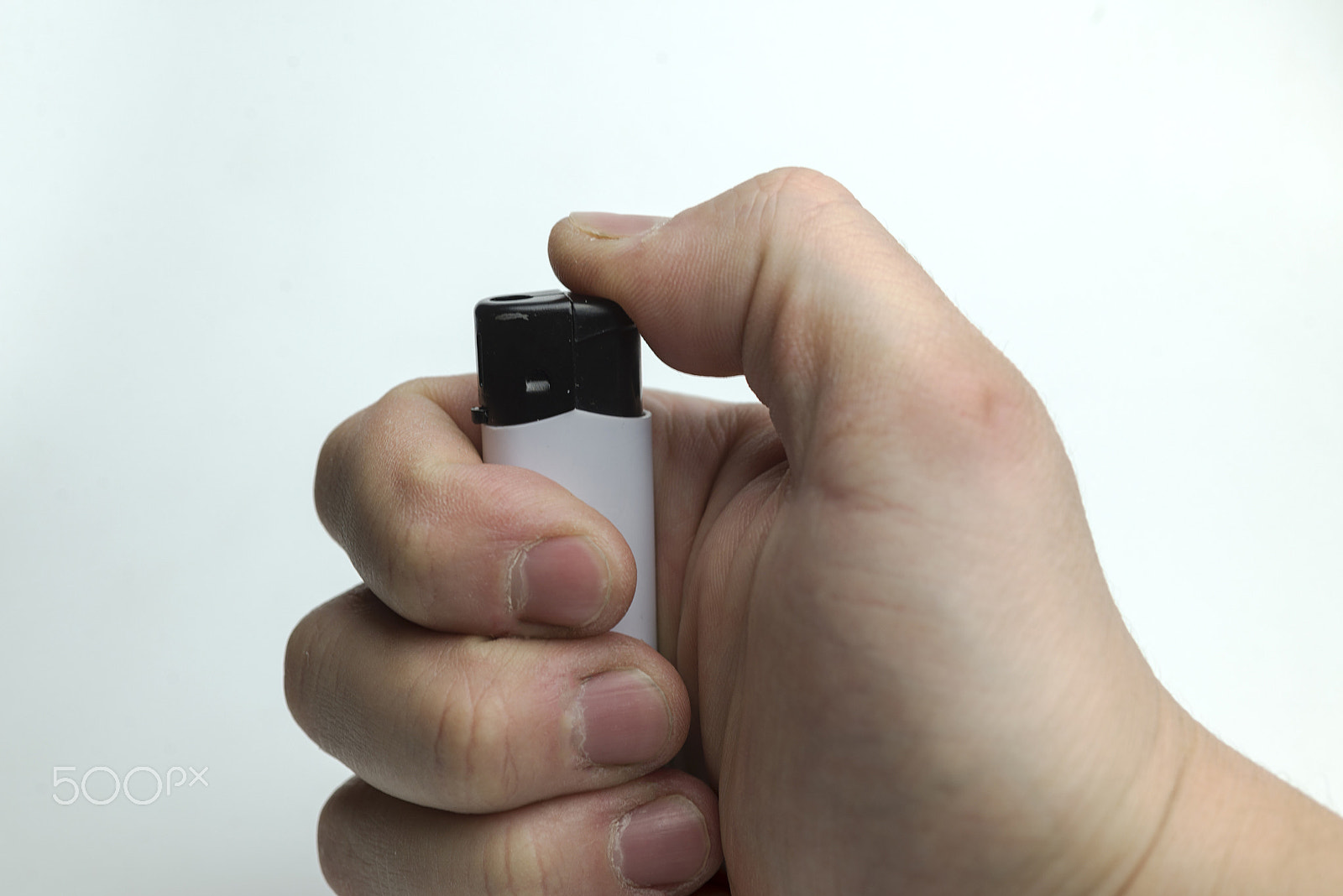 Nikon D600 + Nikon AF Micro-Nikkor 60mm F2.8D sample photo. Hand holding a lighter. photography
