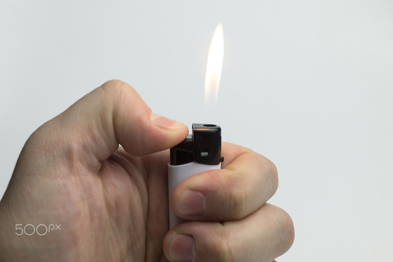Nikon D600 + Nikon AF Micro-Nikkor 60mm F2.8D sample photo. Hand holding a lighter. photography