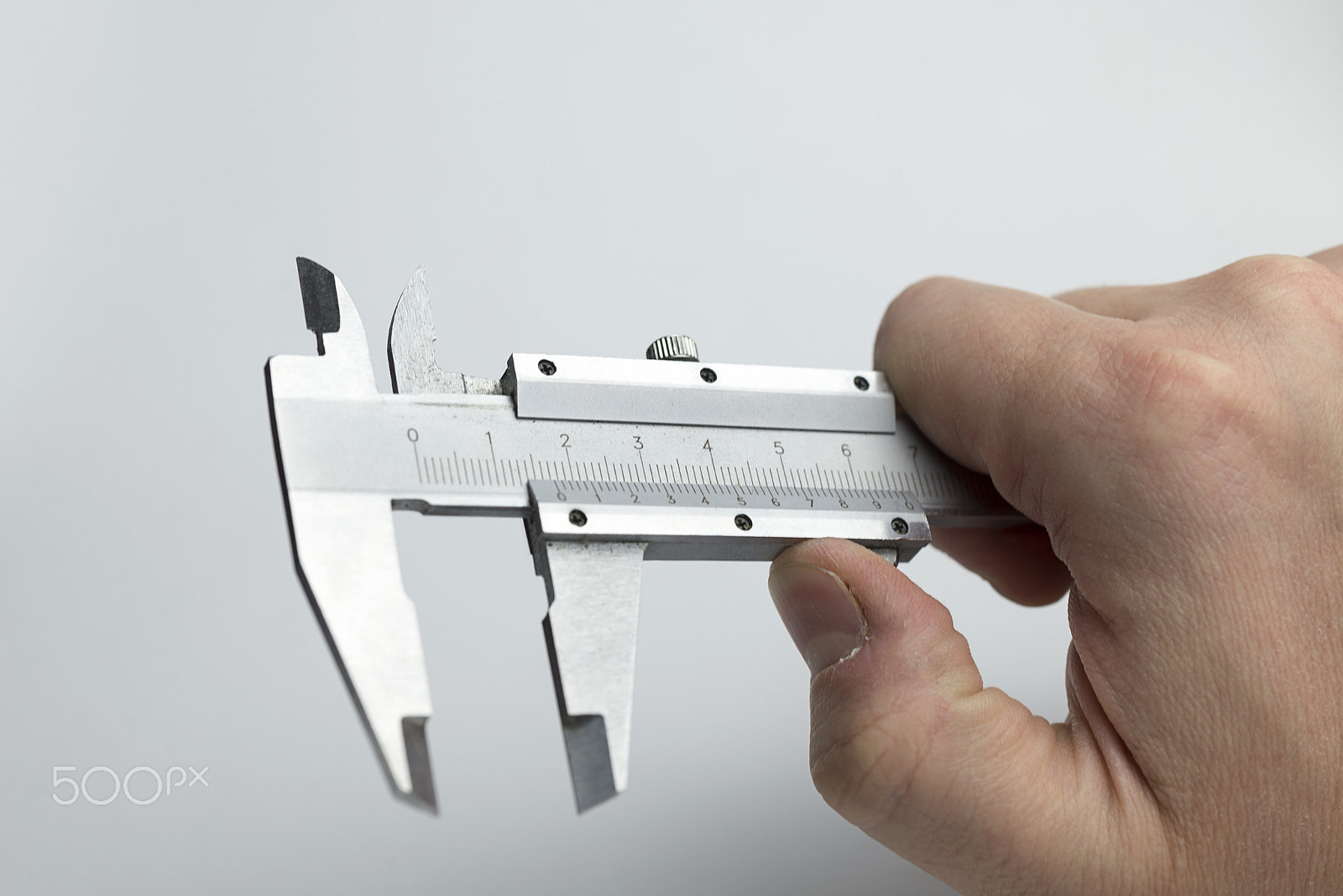 Nikon D600 + Nikon AF Micro-Nikkor 60mm F2.8D sample photo. Hand holding caliper photography