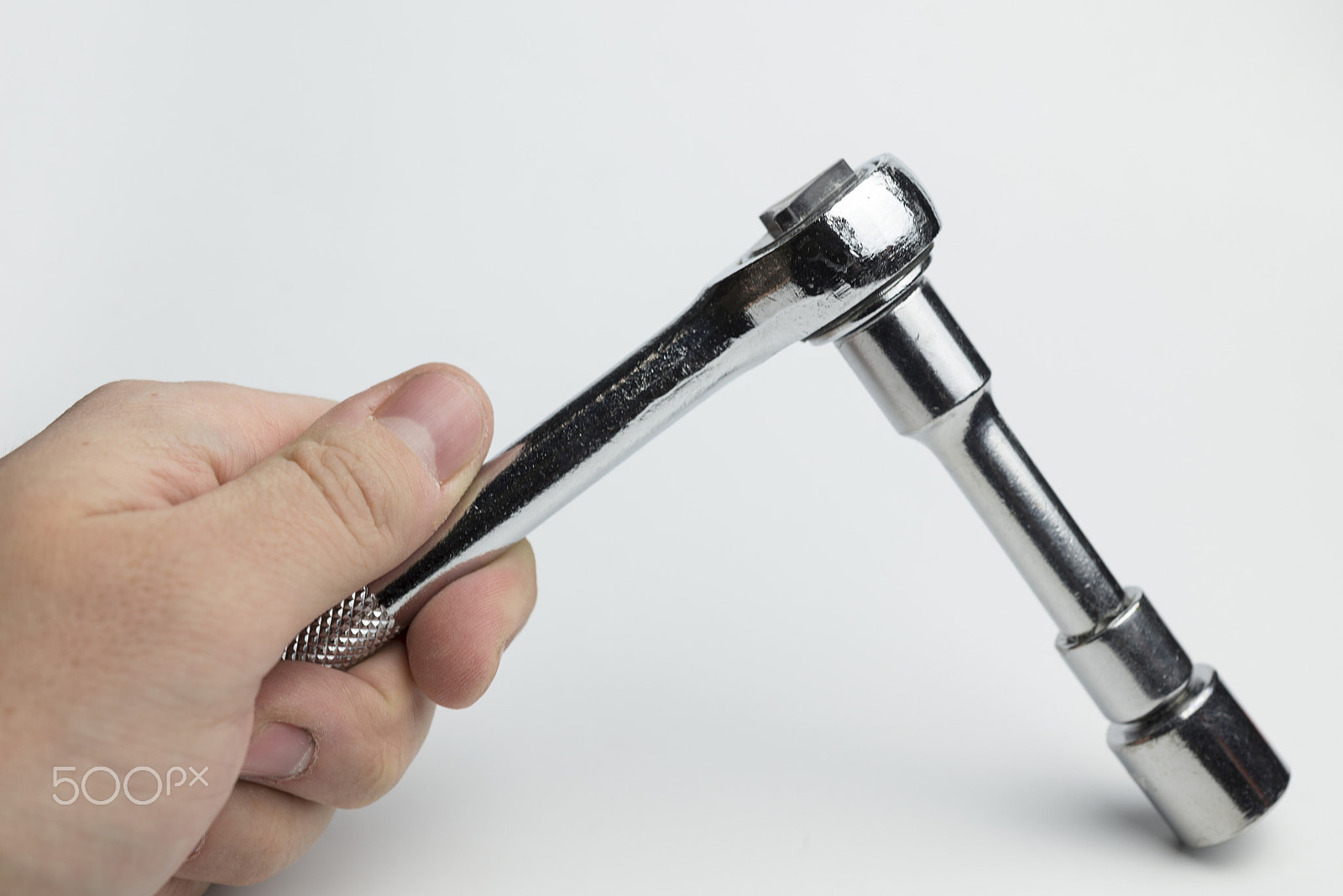 Nikon D600 + Nikon AF Micro-Nikkor 60mm F2.8D sample photo. Hand holds a ratchet. photography
