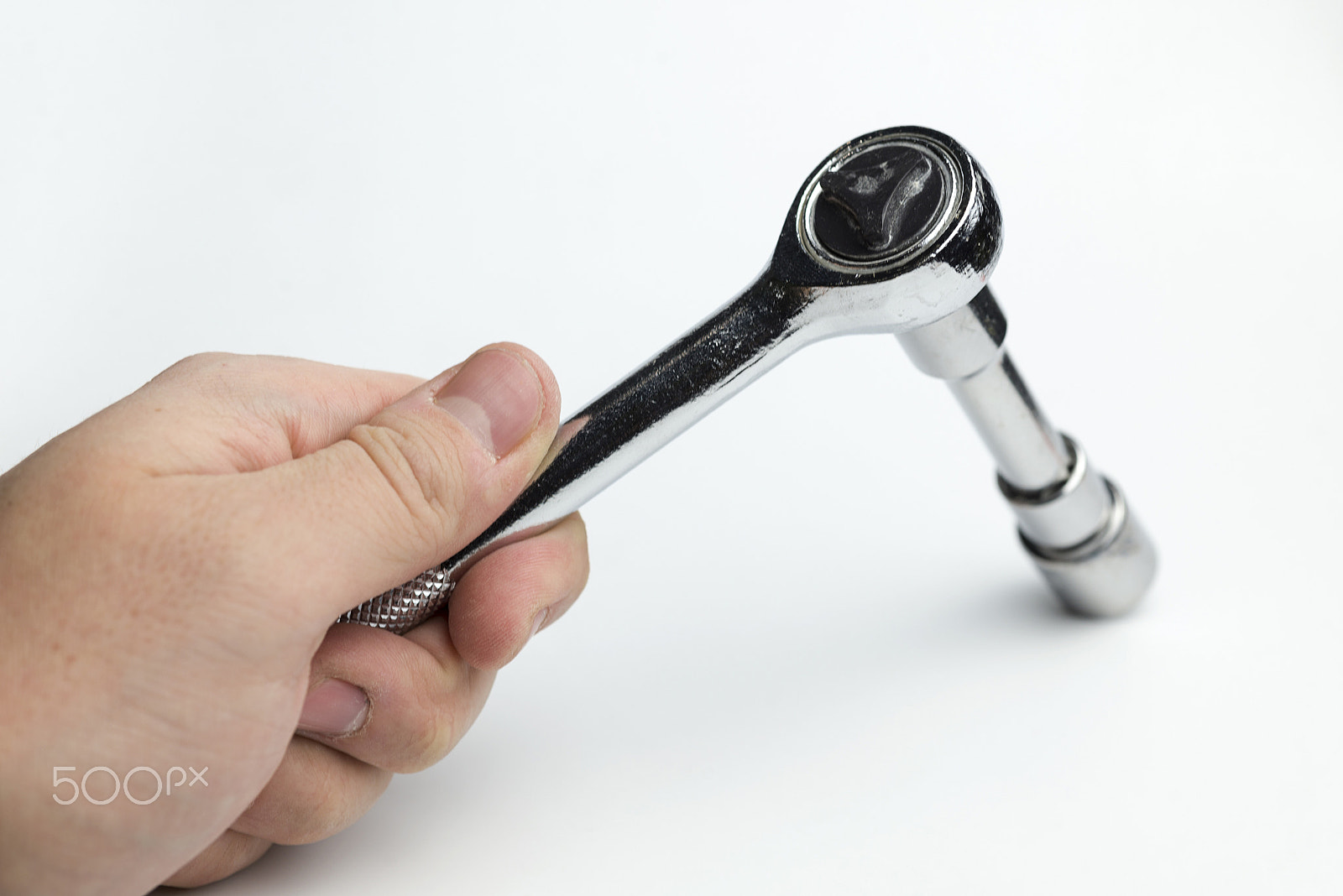 Nikon D600 + Nikon AF Micro-Nikkor 60mm F2.8D sample photo. Hand holds a ratchet. photography