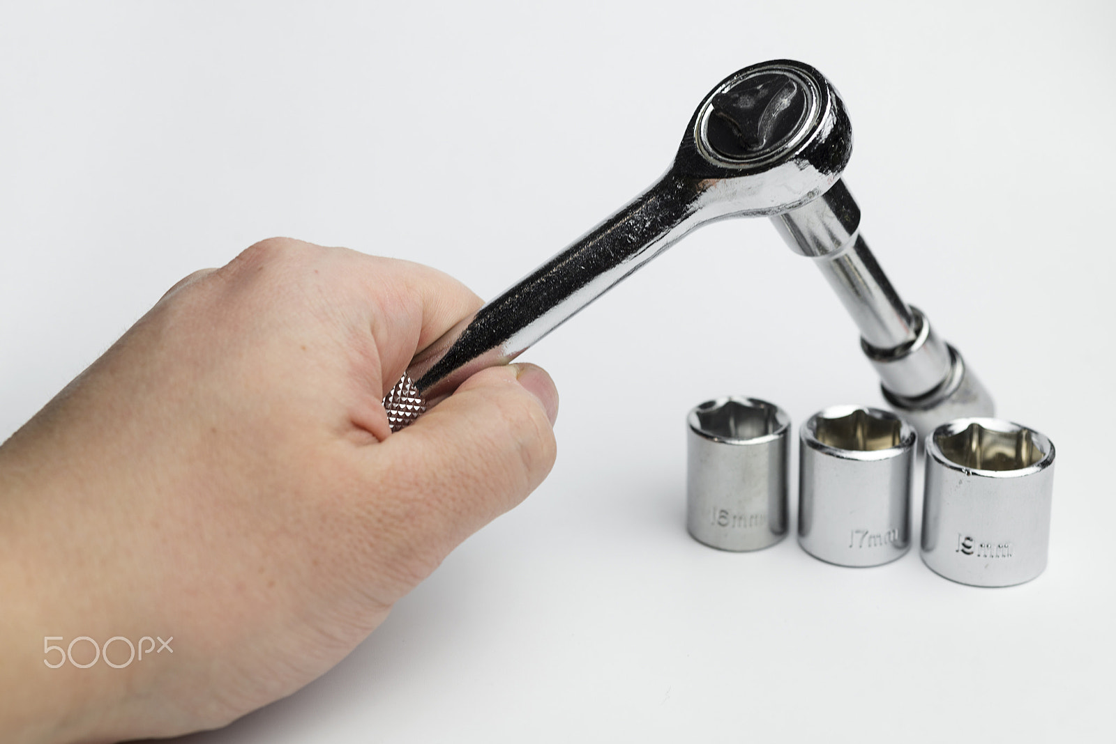 Nikon D600 + Nikon AF Micro-Nikkor 60mm F2.8D sample photo. Hand holds a ratchet. photography