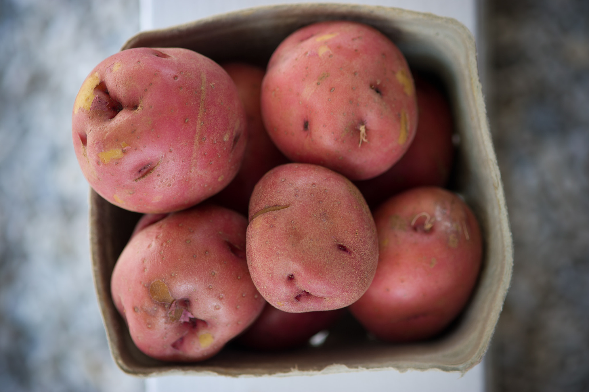 Nikon D3S sample photo. Crate of fresh potatoes at farm stand photography