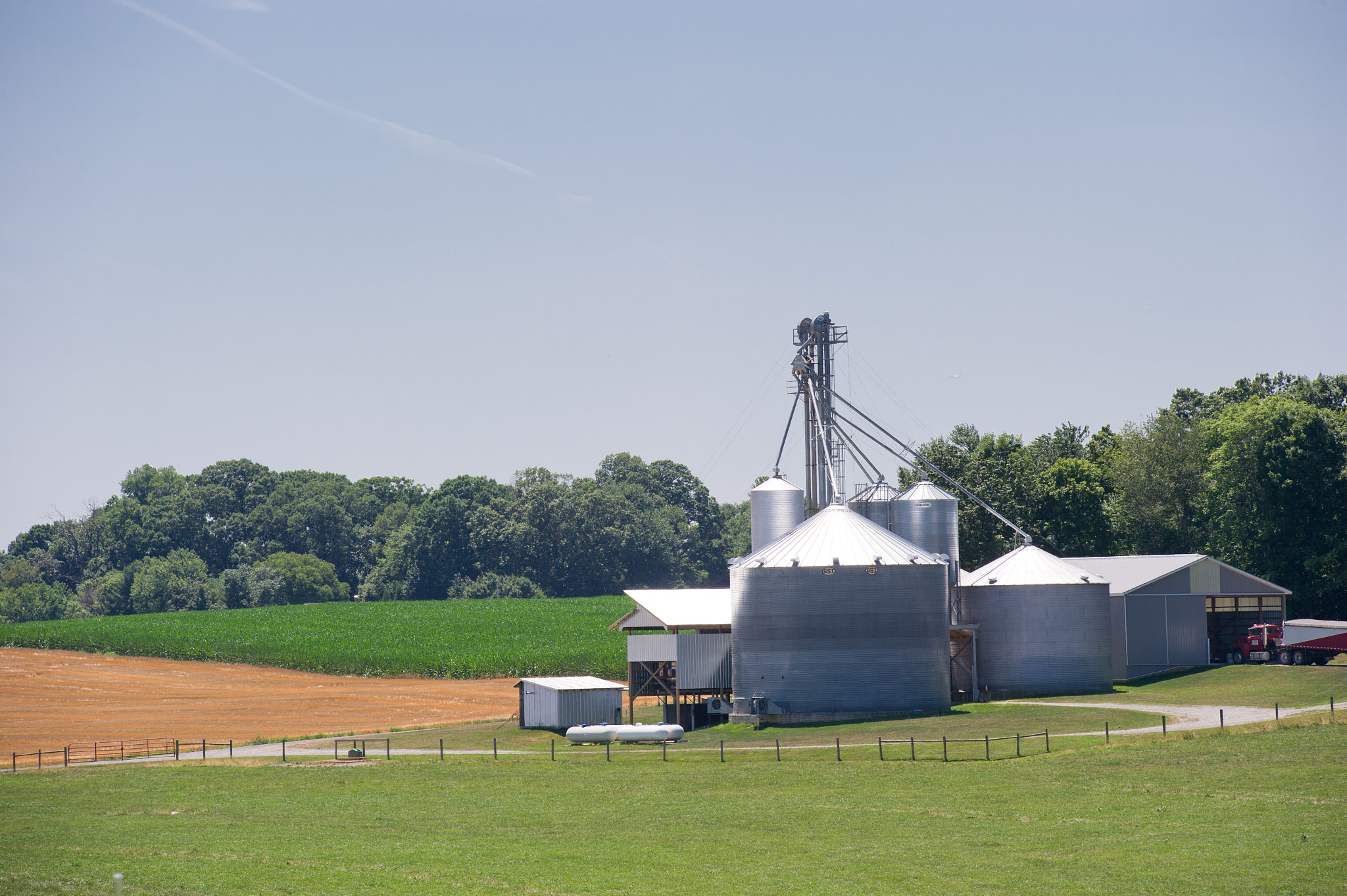 Nikon D3S sample photo. Grain elevator surrounded by farmland photography