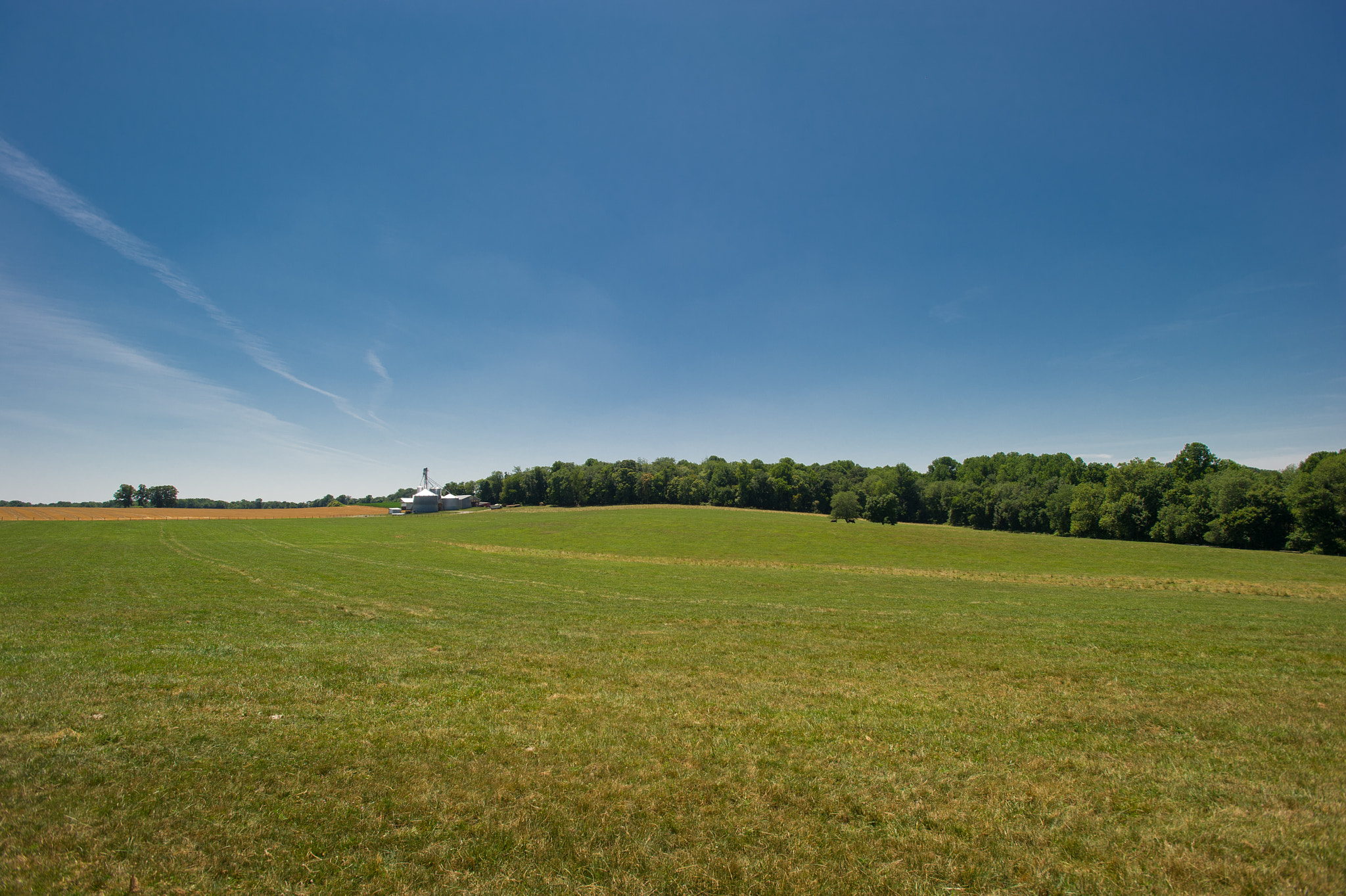 Nikon D3S sample photo. Grain elevator surrounded by wide open field photography