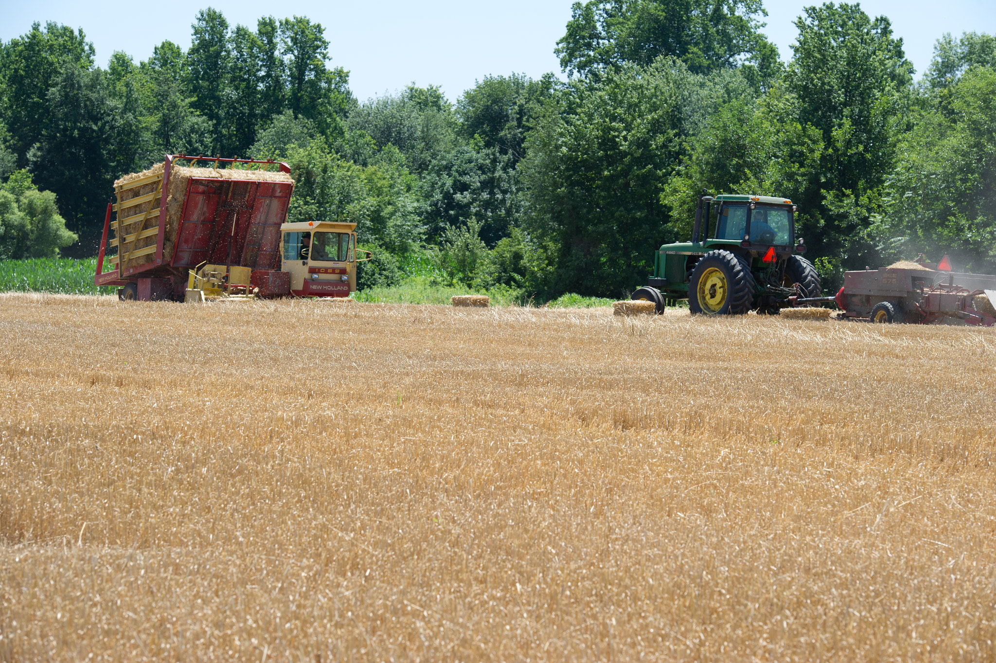 Nikon D3S sample photo. Hay baler operating in field photography