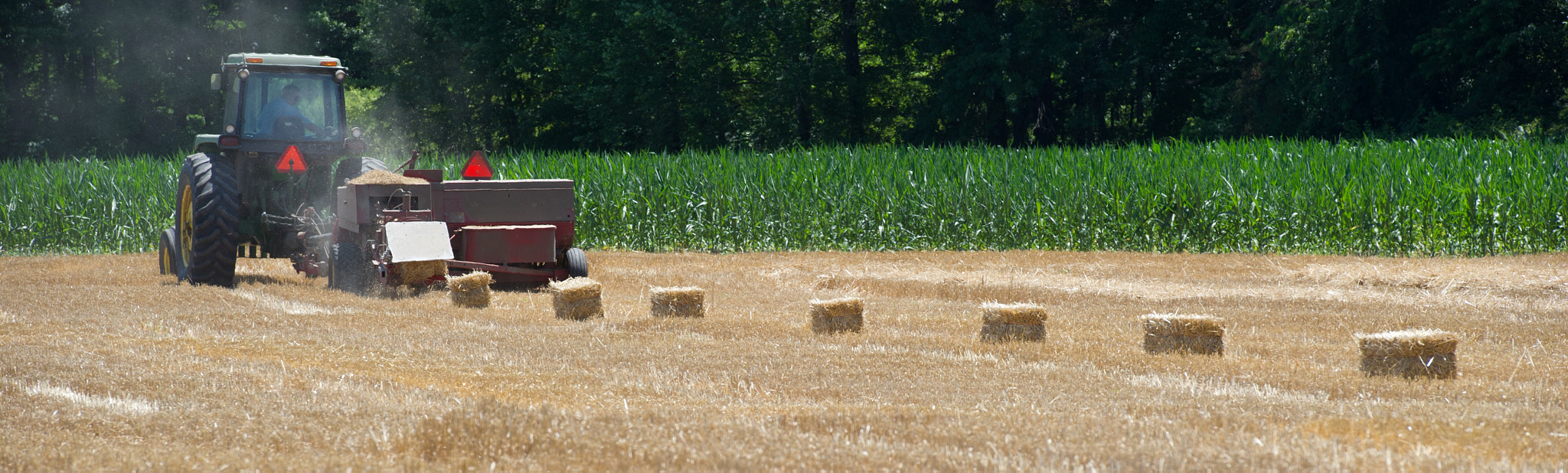 Nikon D3S sample photo. Hay baler operating in field photography