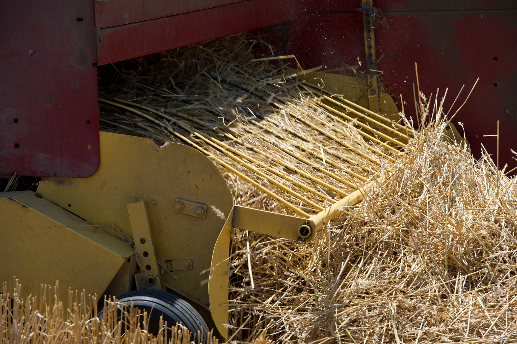 Nikon D3S sample photo. Hay baler operating in field photography