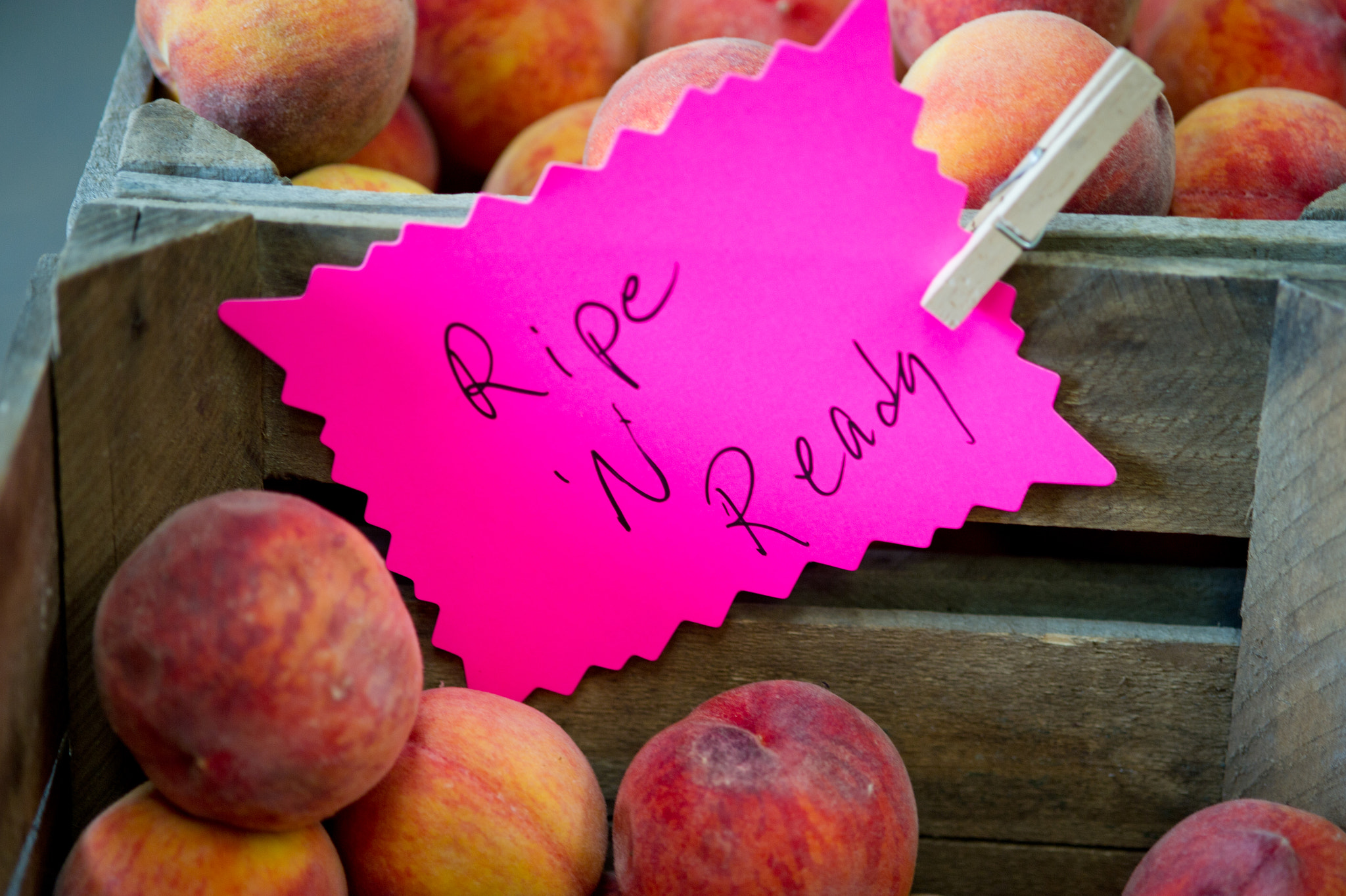 Nikon D3S sample photo. Crates of peaches for sale at a farmer's market photography