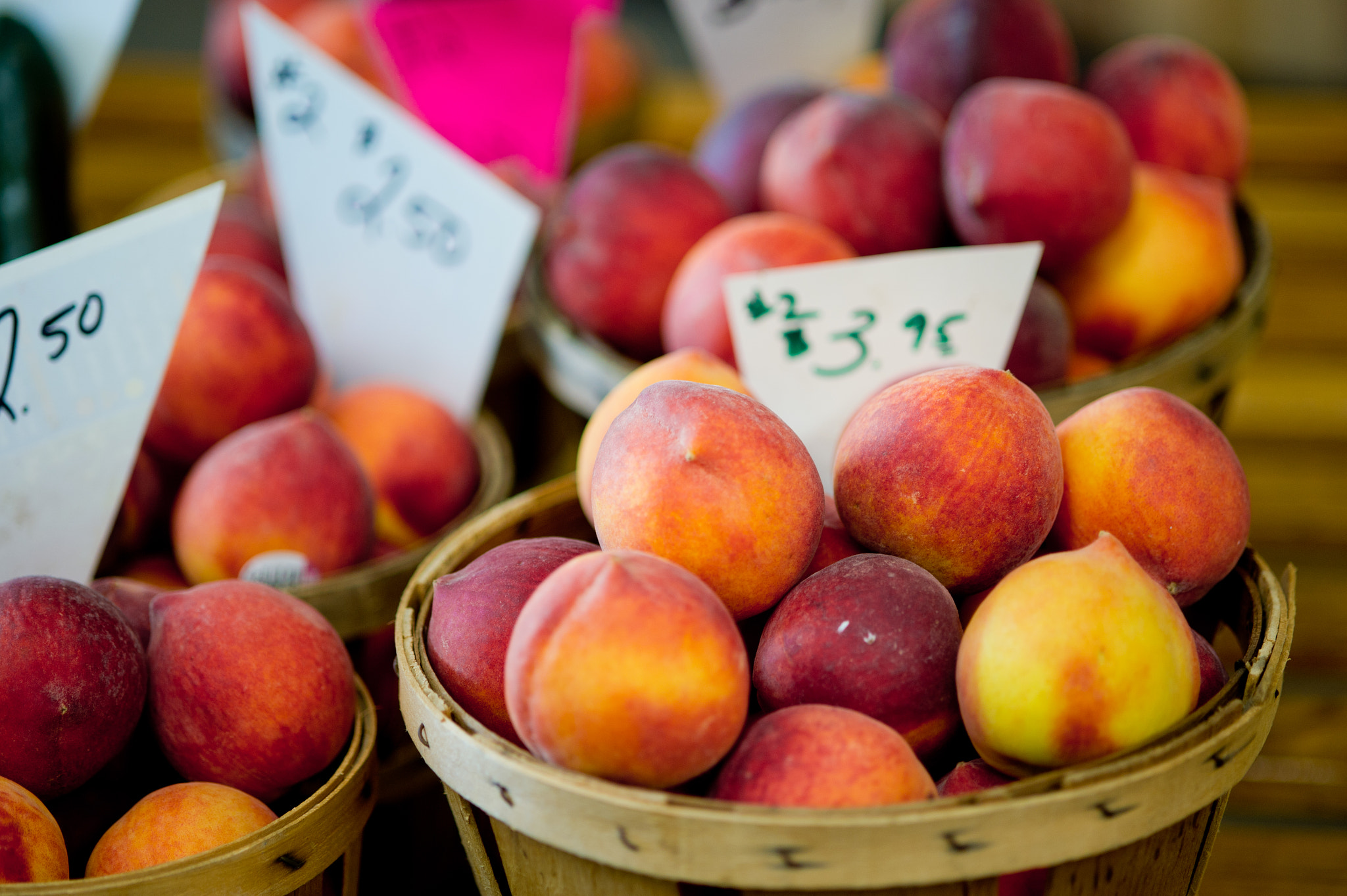 Nikon D3S sample photo. Crates of peaches for sale at a farmer's market photography