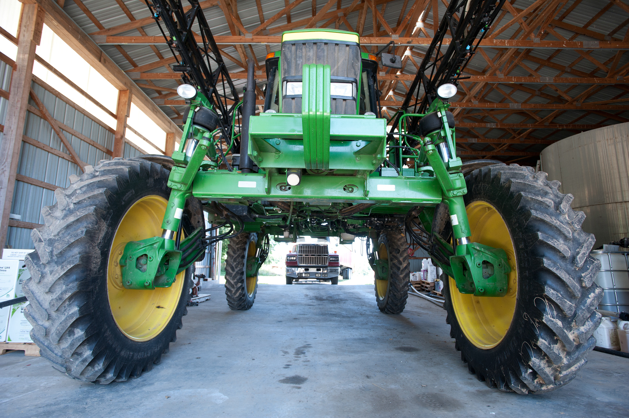 Nikon AF-S Nikkor 17-35mm F2.8D ED-IF sample photo. Tractor in barn on grain producer's farm photography