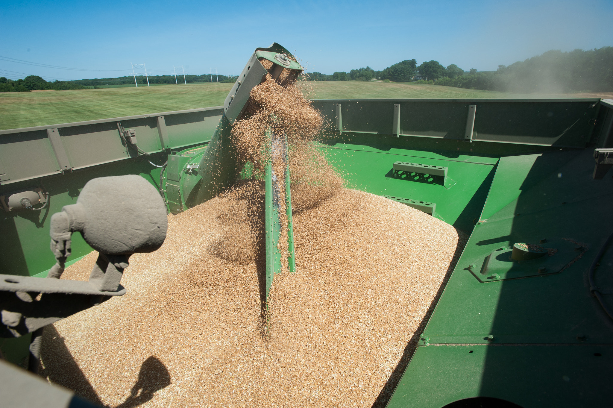 Nikon AF-S Nikkor 17-35mm F2.8D ED-IF sample photo. Combine harvesting grain photography