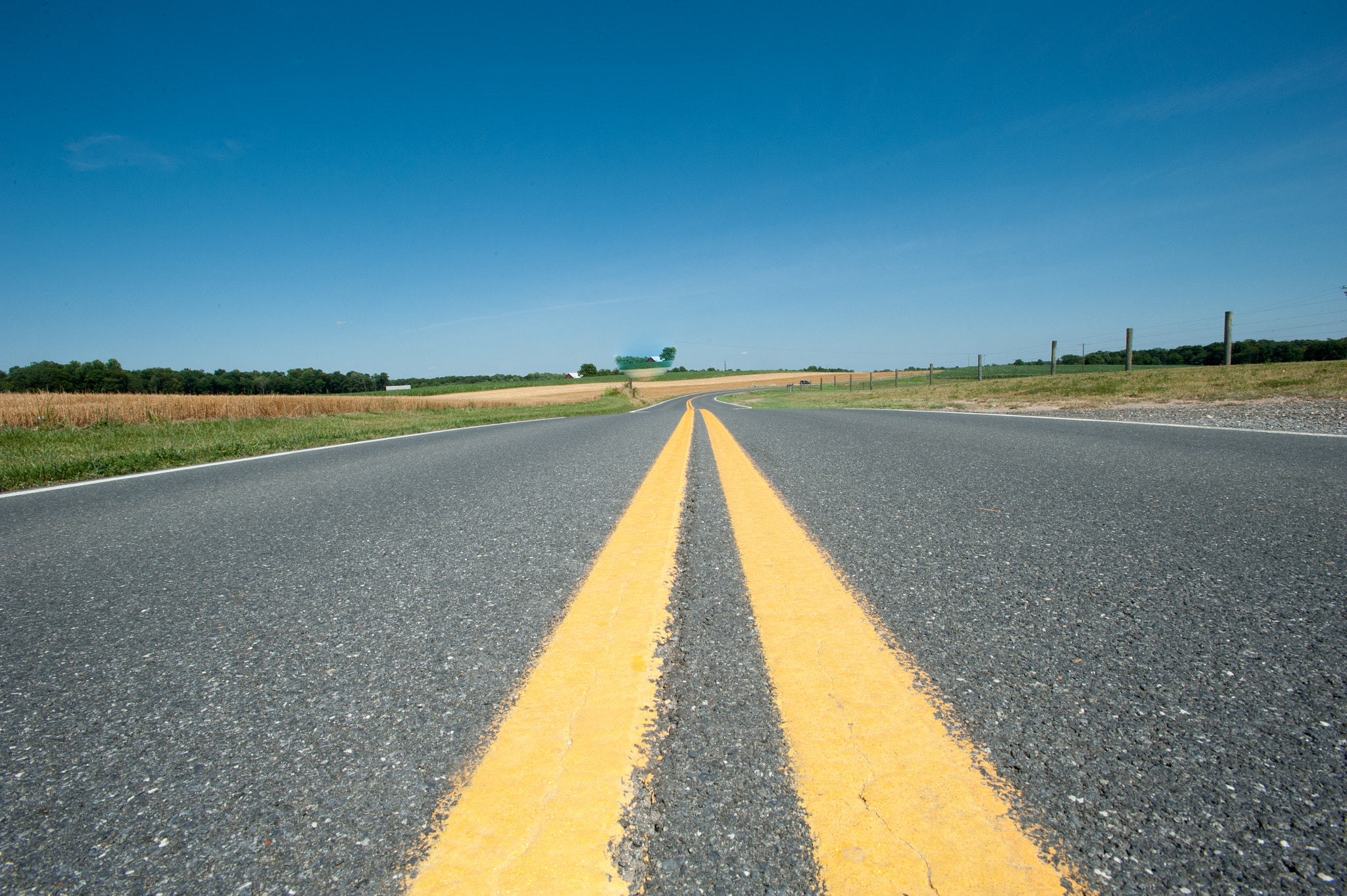 Nikon D700 + Nikon AF-S Nikkor 17-35mm F2.8D ED-IF sample photo. Stretch of road going off into the horizon photography