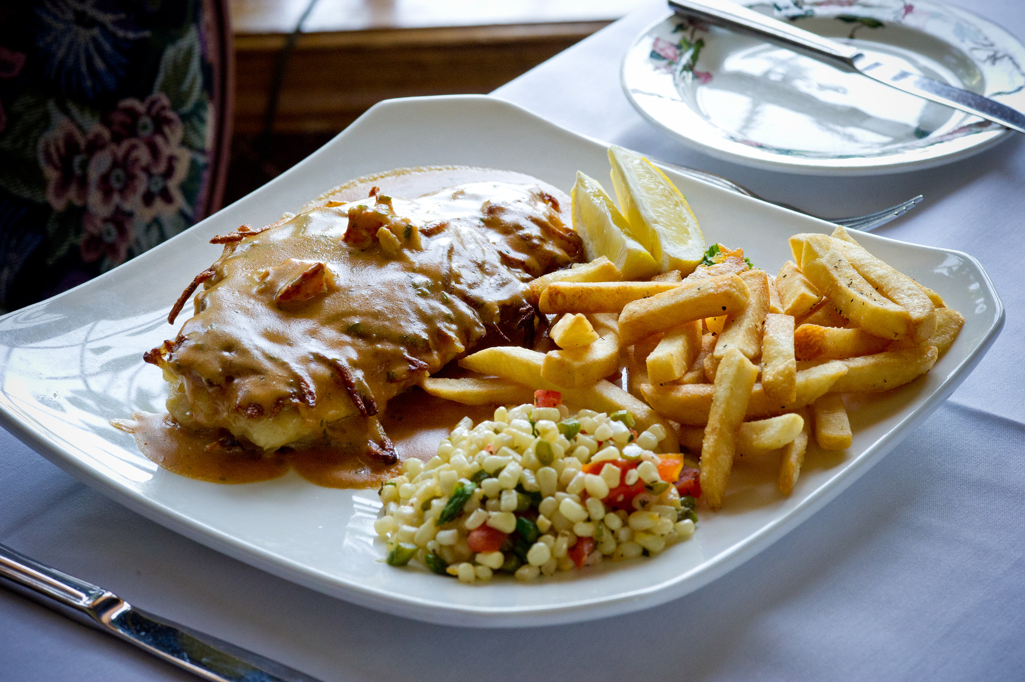 ZEISS Makro-Planar T* 100mm F2 sample photo. Orange roughy fish with cream bearnaise sauce, french fries, garden corn salad photography