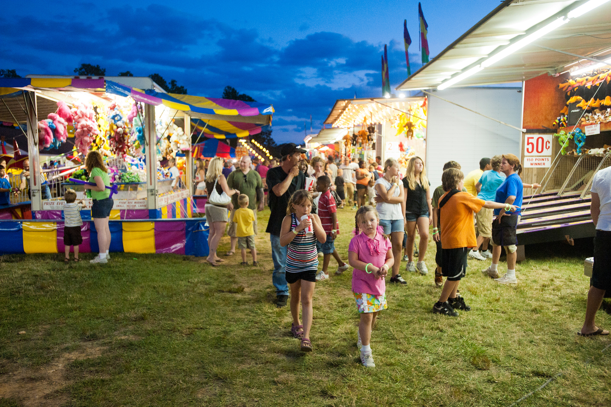 Nikon AF-S Nikkor 17-35mm F2.8D ED-IF sample photo. Children walking through the carnival of the mason dixon fair photography