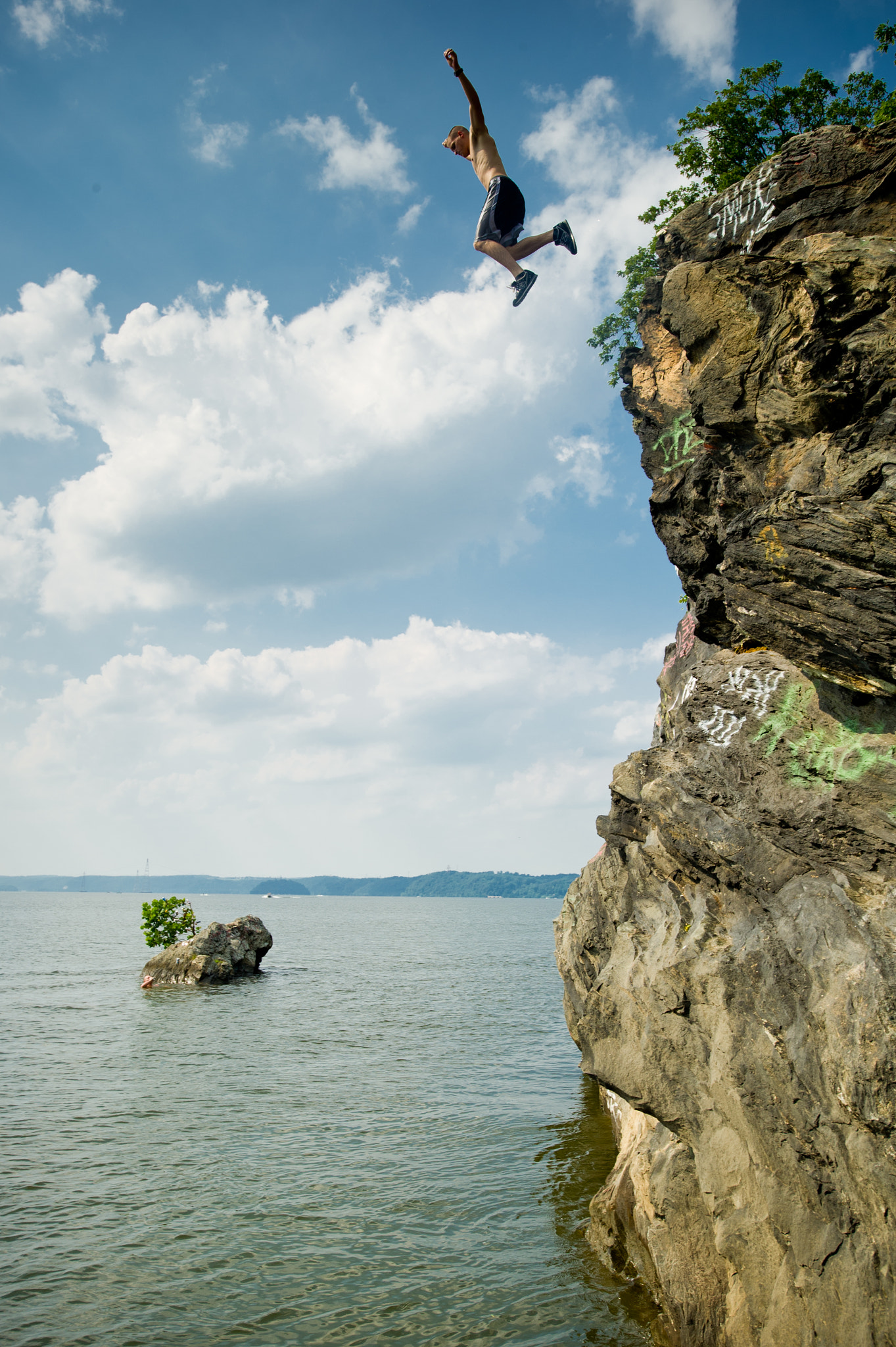 Nikon D3S + Nikon AF-S Nikkor 17-35mm F2.8D ED-IF sample photo. Cliff diver falling into the water in maryland near mason dixon line photography