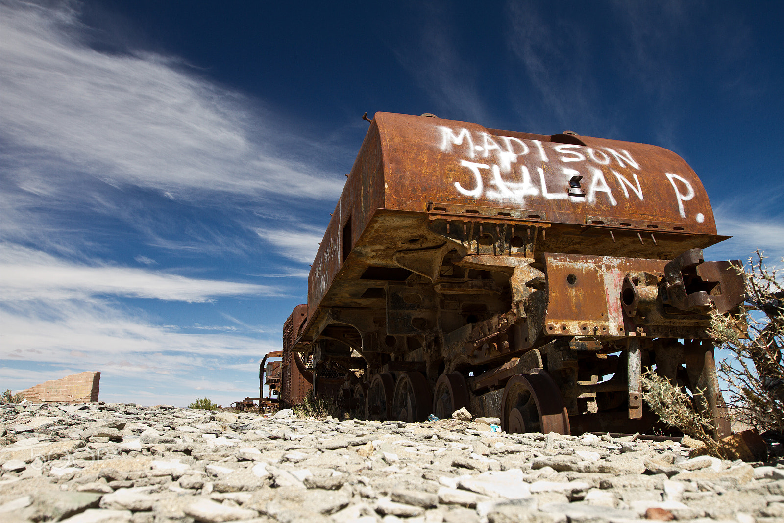 Canon EF 16-35mm F2.8L II USM sample photo. Rust vandalized train in uyuni train cemetery photography