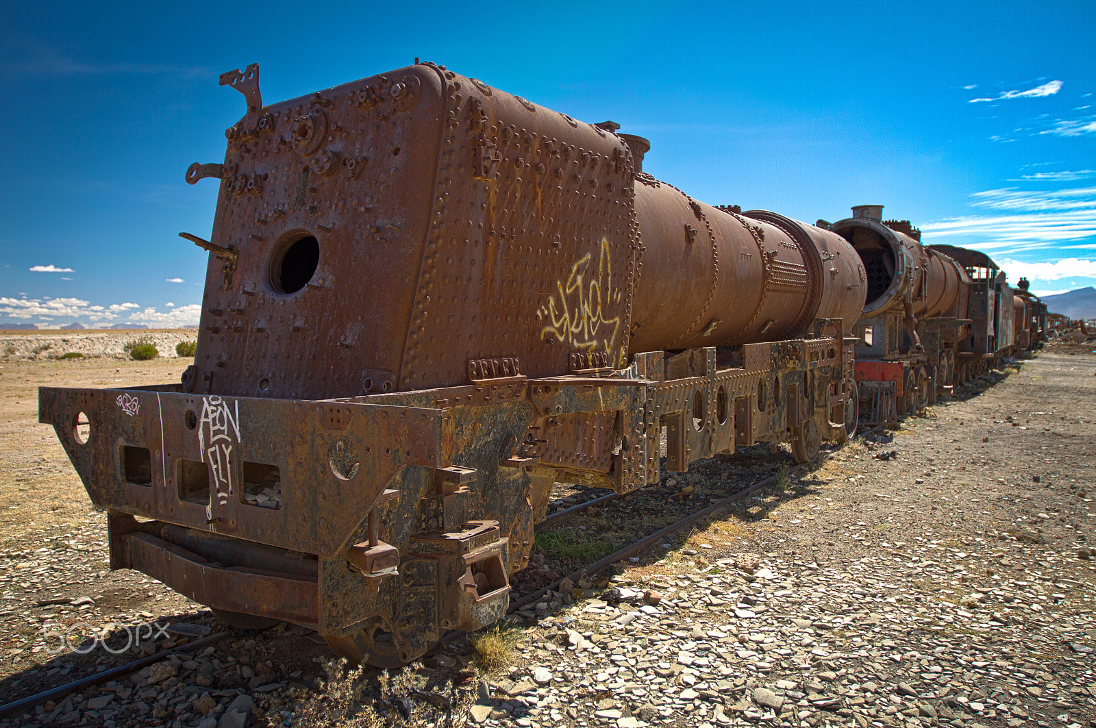Canon EOS 7D + Canon EF 16-35mm F2.8L II USM sample photo. Rusted and decaying train in uyuni train cemetery photography