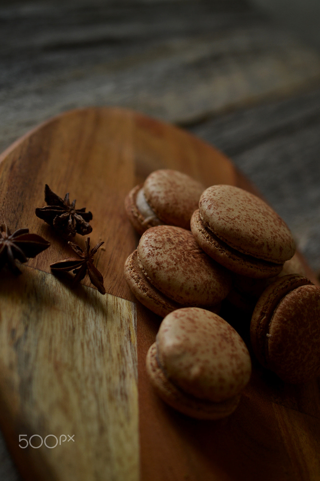 Nikon AF-S DX Micro Nikkor 40mm F2.8 sample photo. Macarons on dark cutting board with star anise photography