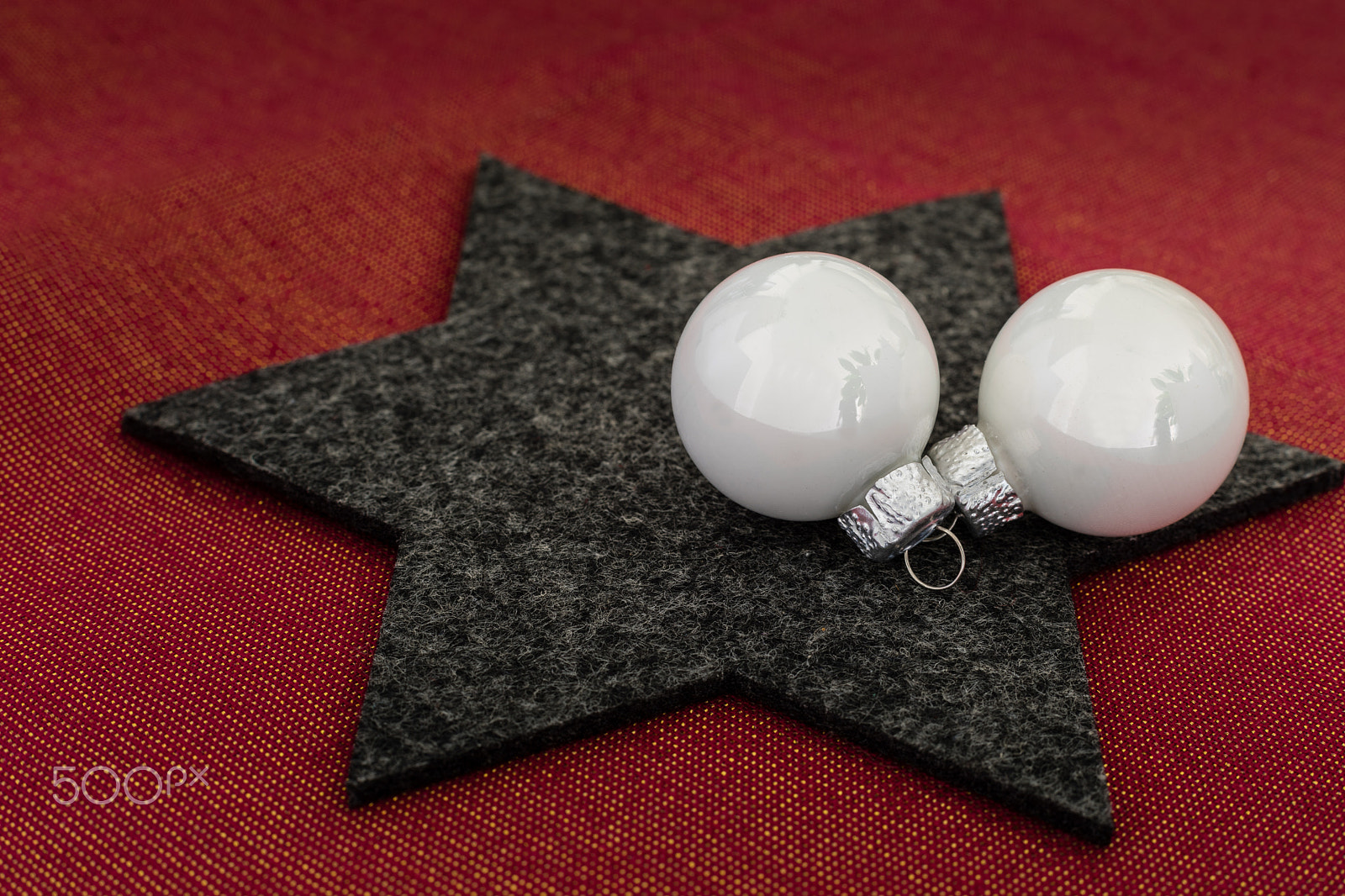 Canon EF 50mm F1.4 USM sample photo. 2 white christmas tree balls on black felt star photography