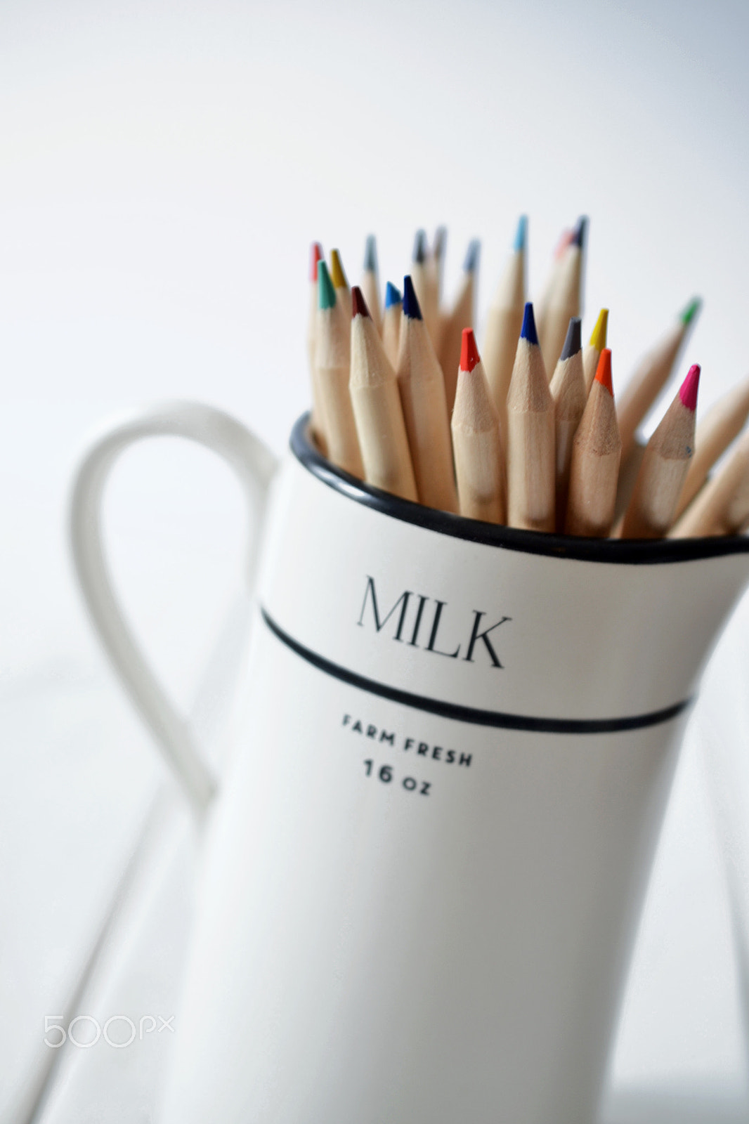 Nikon AF-S DX Micro Nikkor 40mm F2.8 sample photo. Pencil crayons in milk pitcher photography