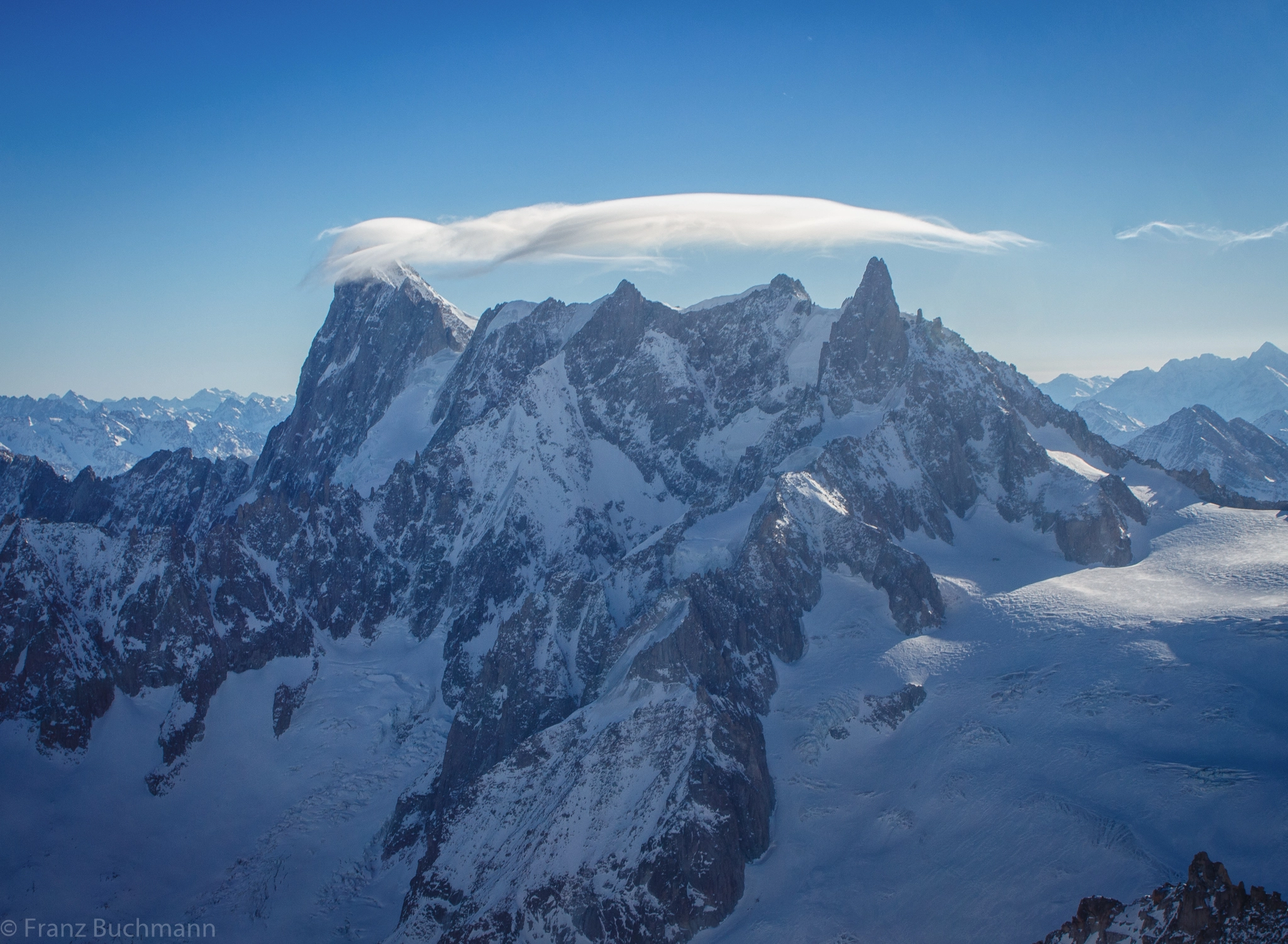 Canon EF 28-80mm f/3.5-5.6 USM sample photo. Lonely cloud over the frozen mountain top photography