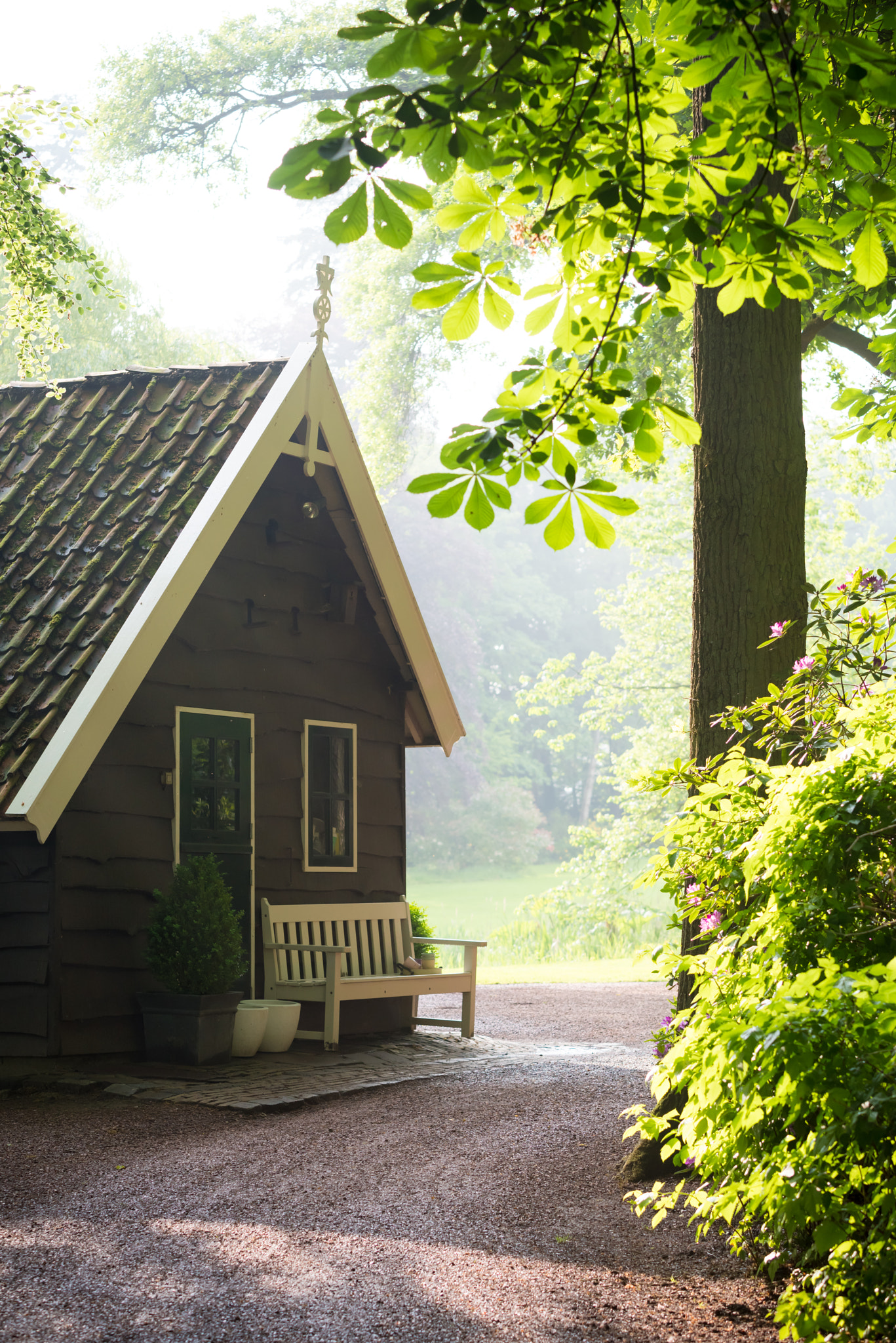 Pentax K-1 + Tamron SP AF 70-200mm F2.8 Di LD (IF) MACRO sample photo. House with bench in park photography