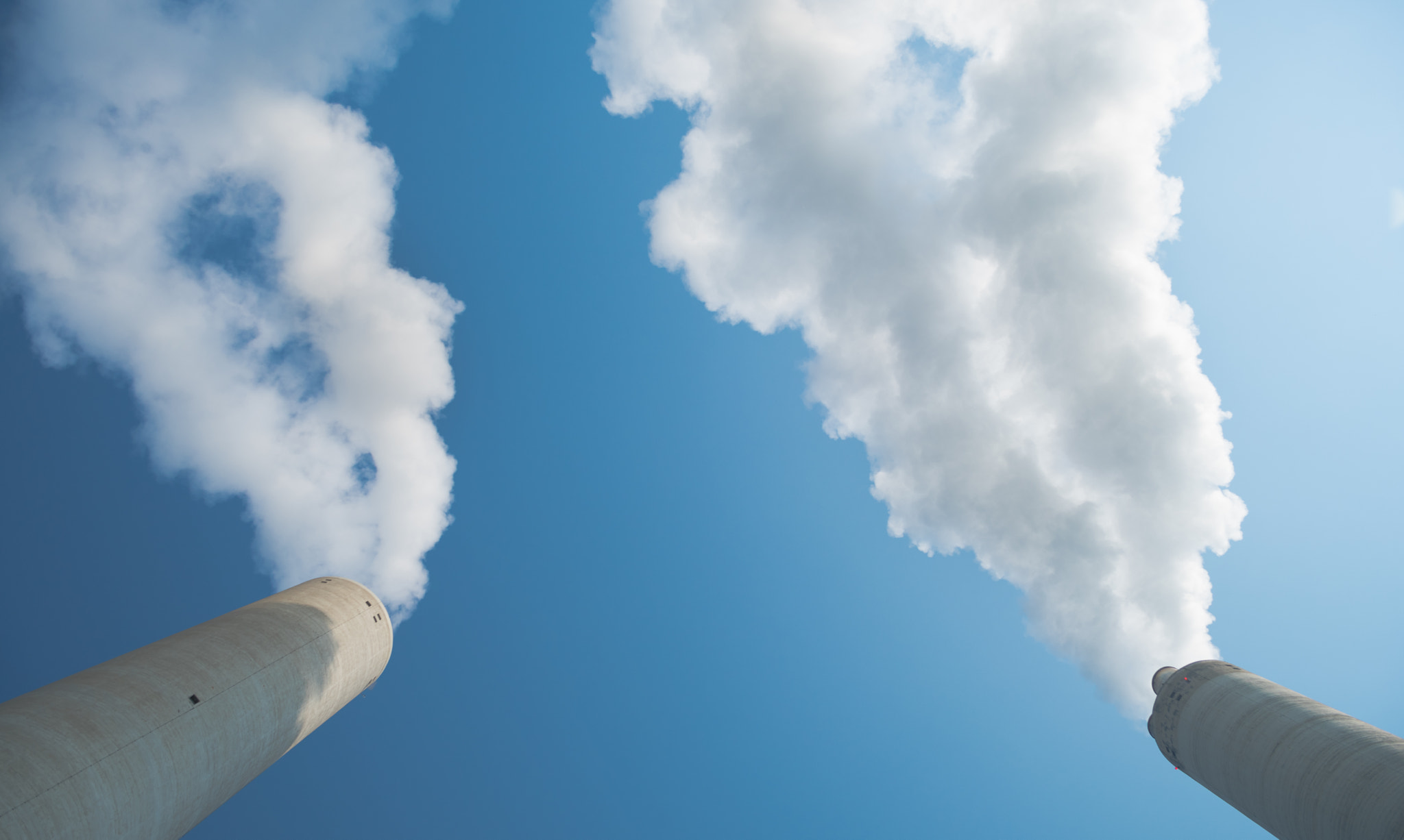 Pentax K-1 sample photo. Smoking chimneys against blue sky photography
