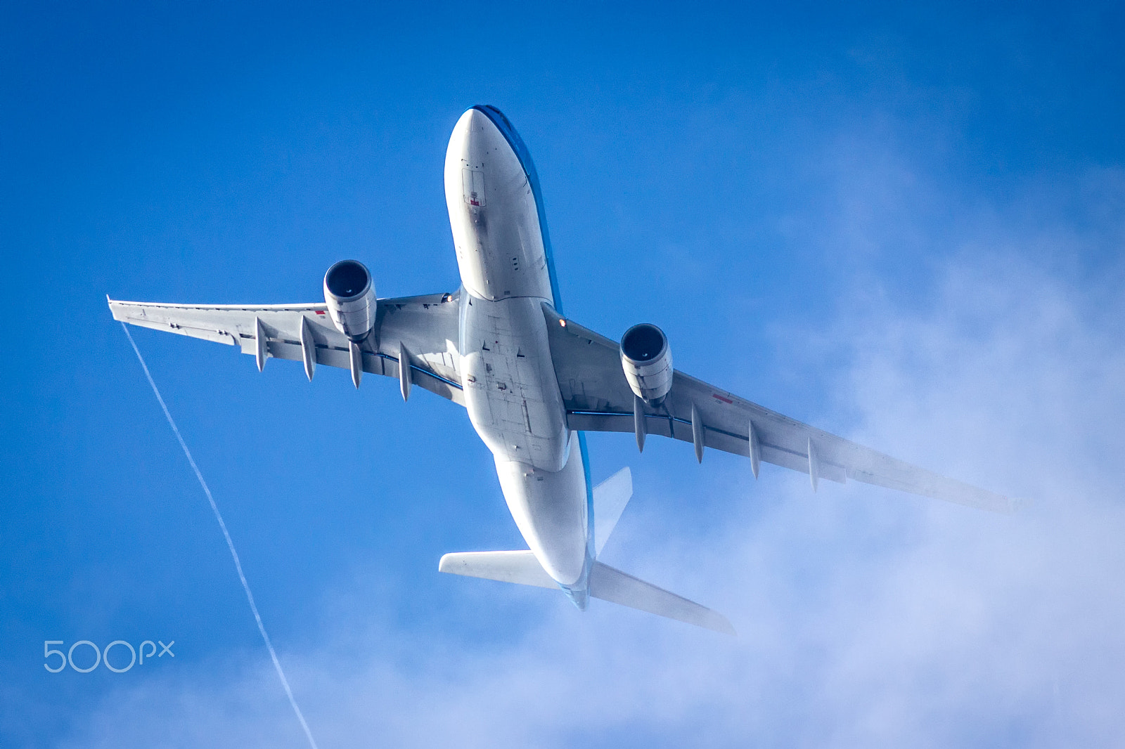 Canon EF 300mm F4L IS USM sample photo. Airplane flying through a cloud photography