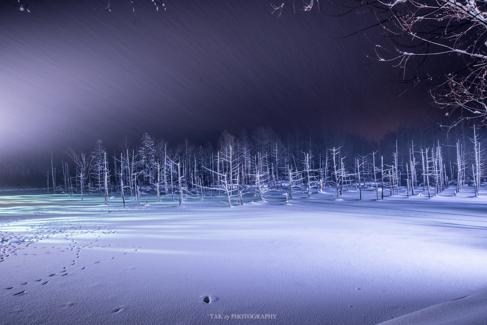 Nikon AF-S Nikkor 18-35mm F3.5-4.5G ED sample photo. Snowstorm blue pond photography