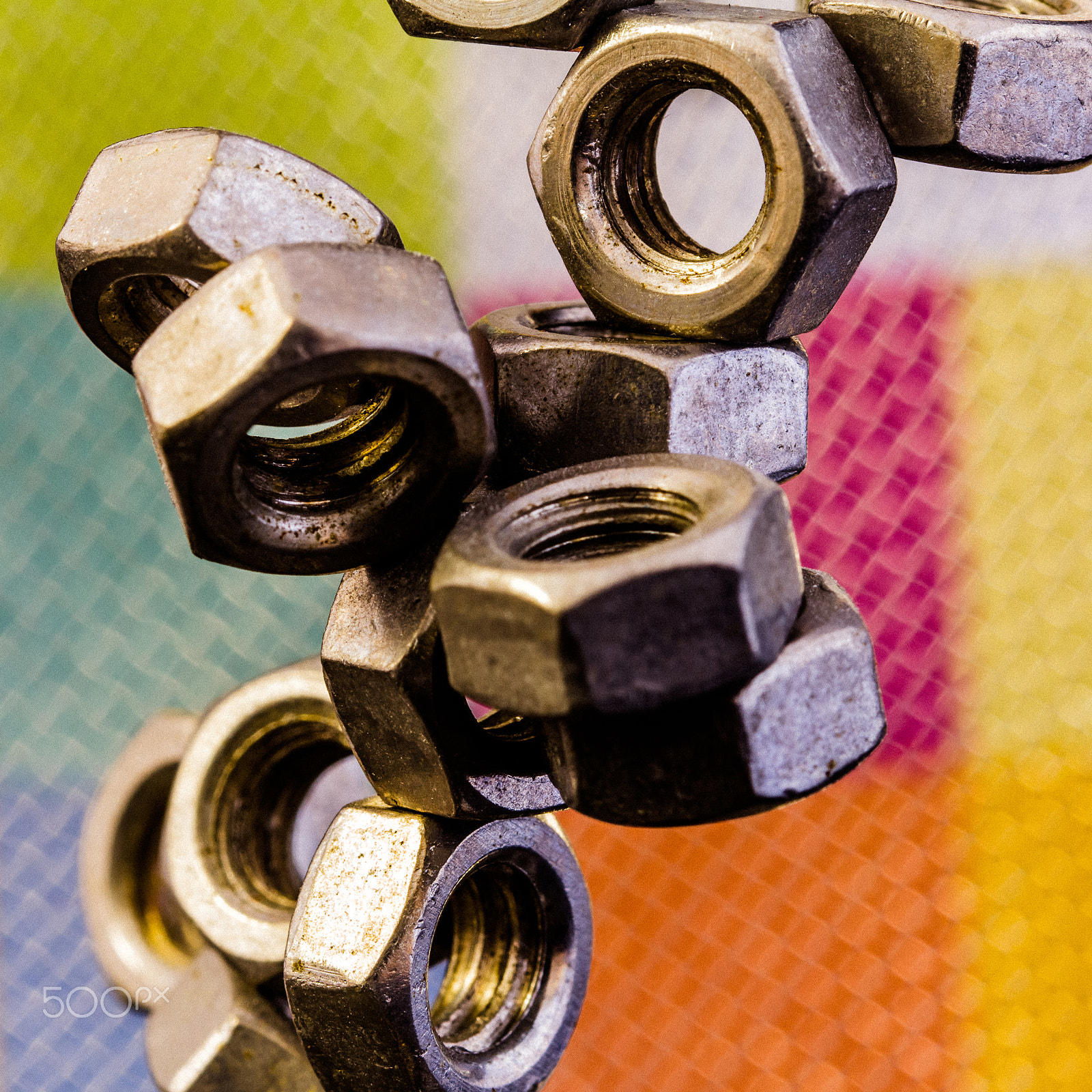 Canon EF 100mm F2.8L Macro IS USM sample photo. Nut in front of colors #3 photography