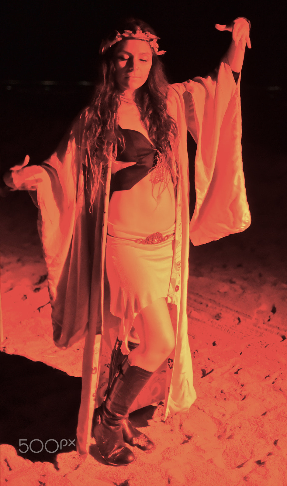 Nikon D750 + Nikon AF Nikkor 35mm F2D sample photo. Woman performer at night on beach photography
