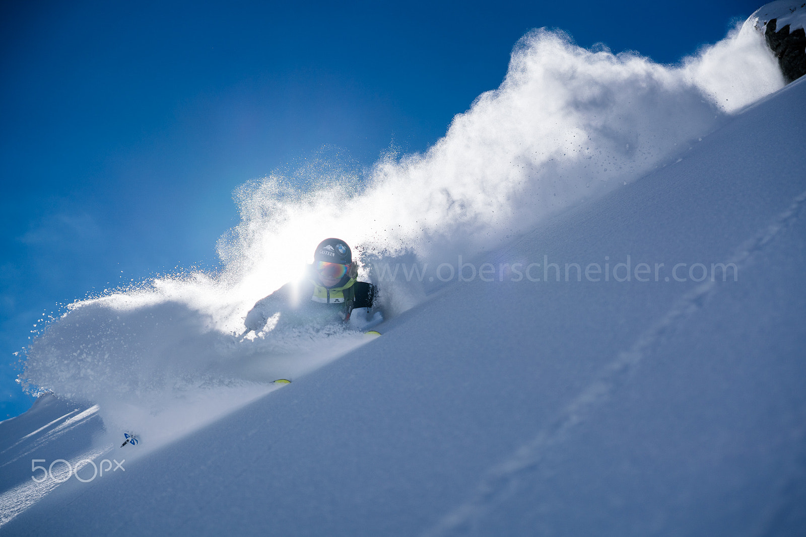Sony a99 II sample photo. Backlit powder skiing photography