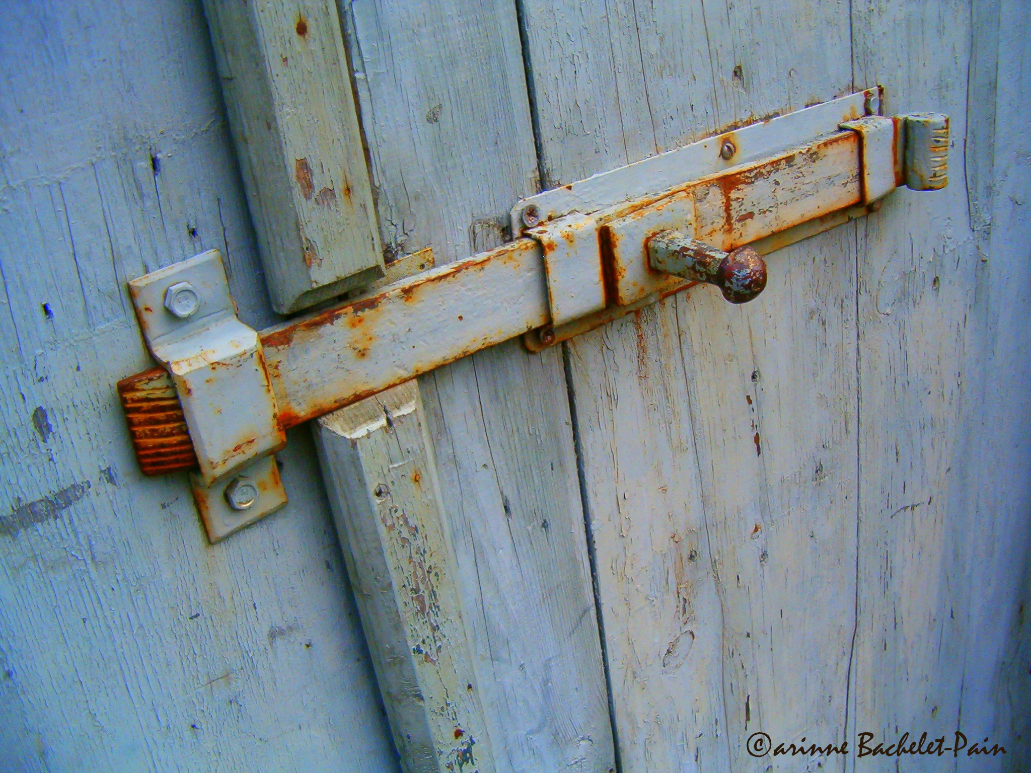 HP PHOTOSMART 735 sample photo. Rusty lock on a blue wooden door photography